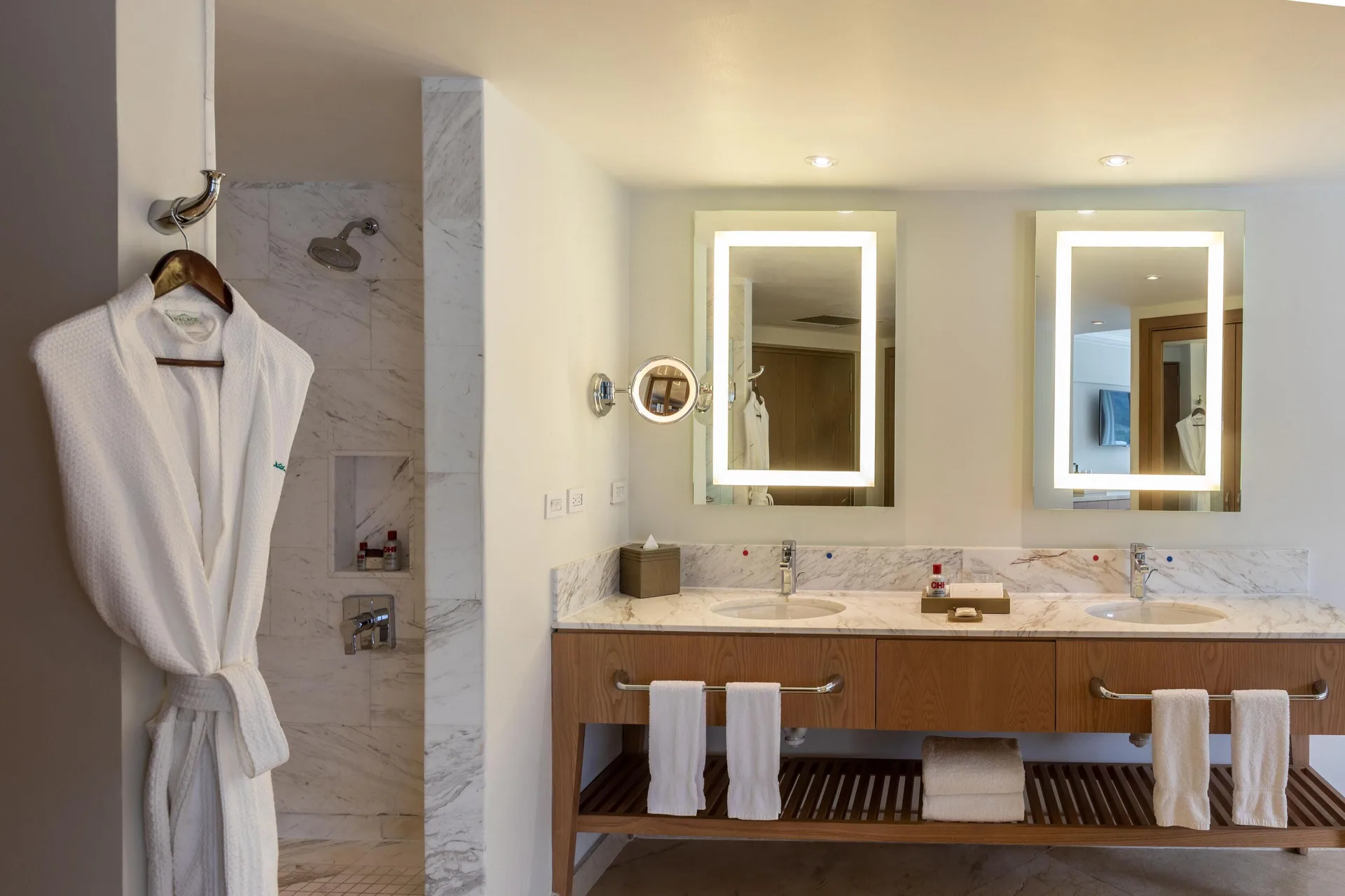 Double vanity and marble shower in a presidential suite bathroom at Moon Palace Jamaica.