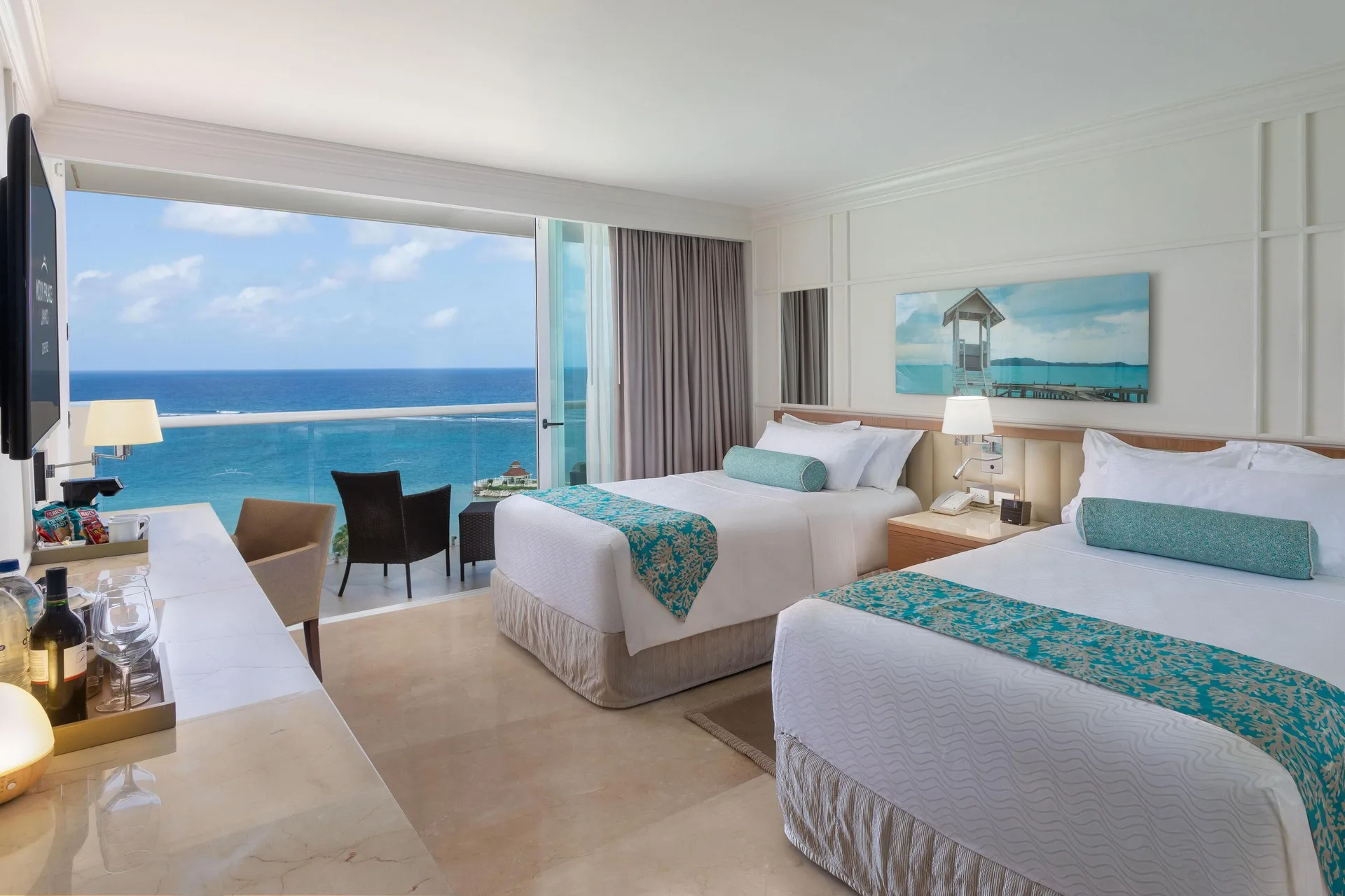Two-bed bedroom with balcony ocean view at Moon Palace Jamaica.