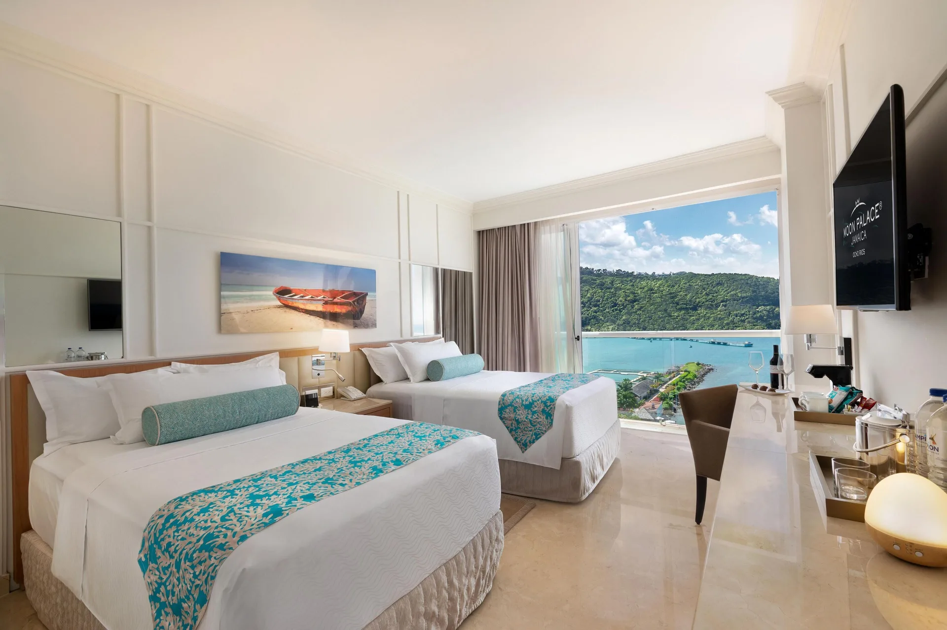 Two-bed ocean-view bedroom in a suite at Moon Palace Jamaica.