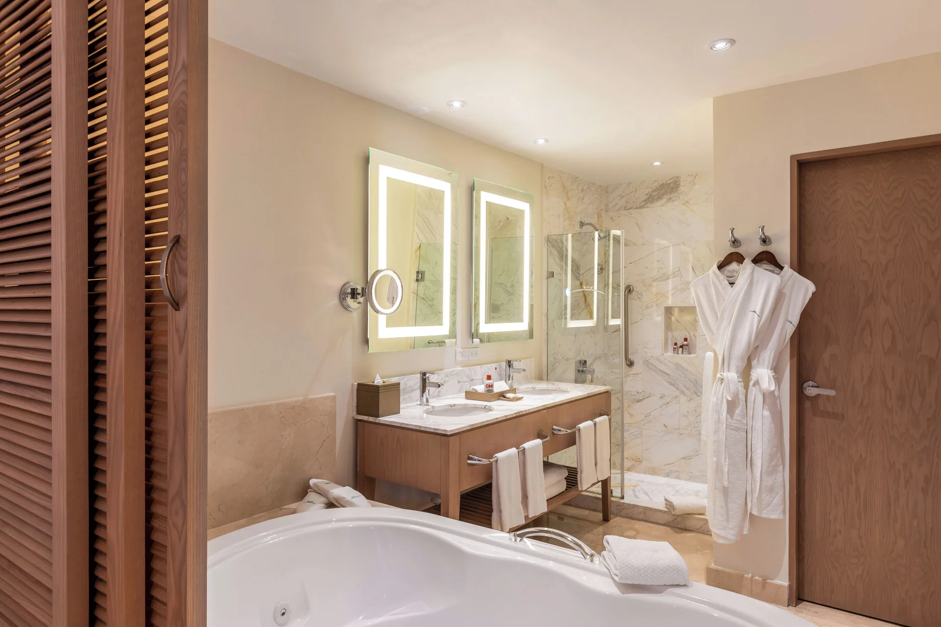 Three Bedroom Villa bathroom with soaking tub and glass shower at Moon Palace Jamaica.