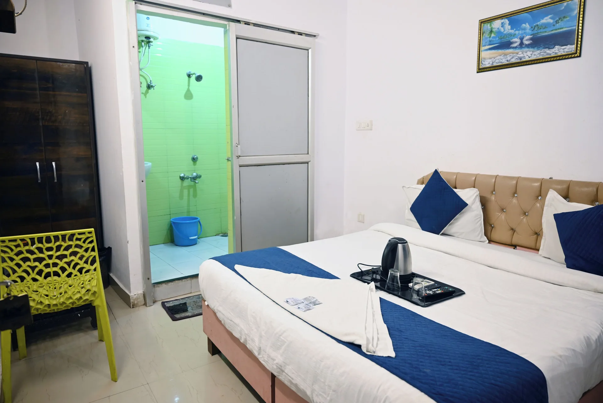 Deluxe Room city view bed and open bathroom doorway at Moon Palace.