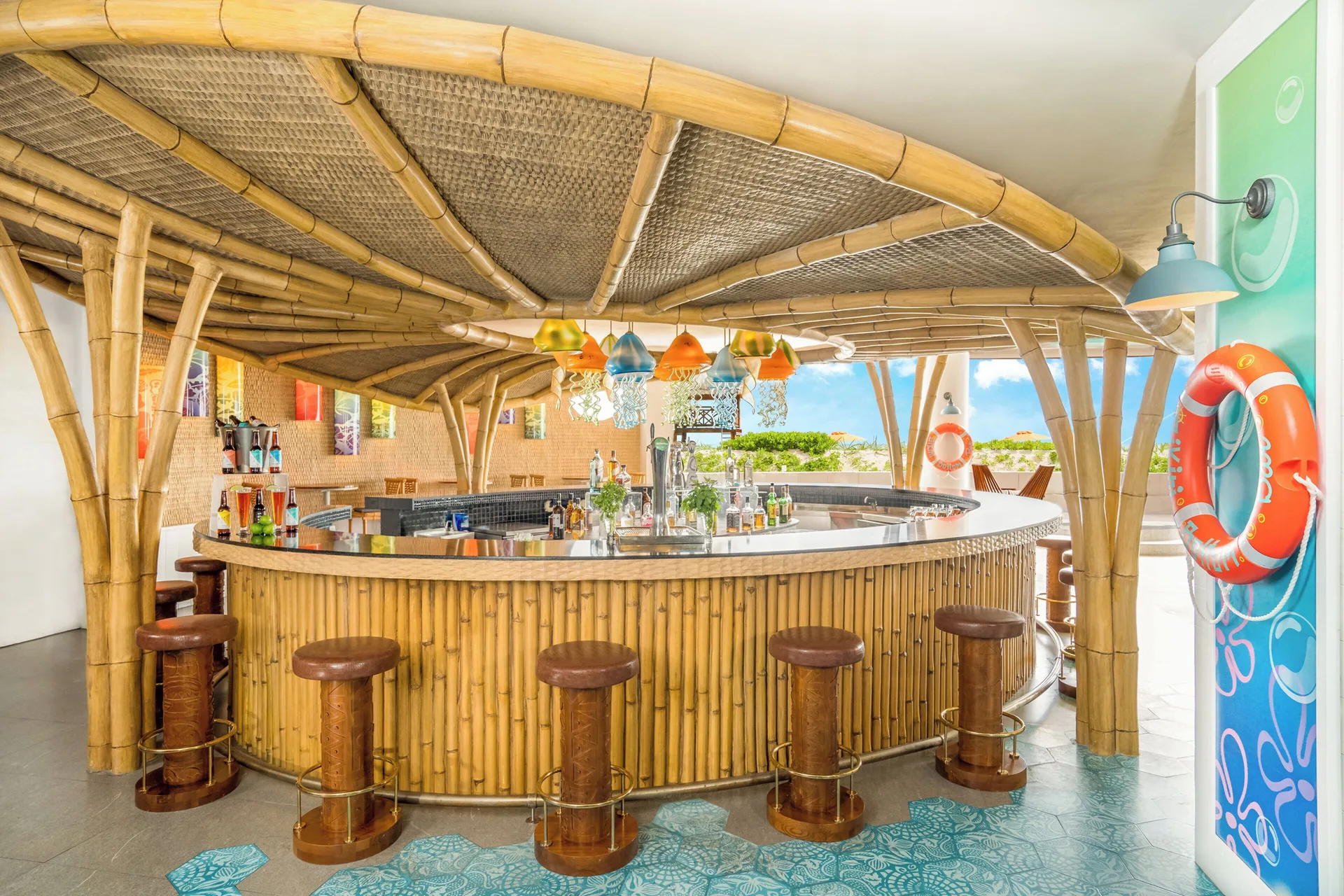 Bamboo-style circular bar with stools at Nickelodeon Hotels & Resorts Riviera Maya.