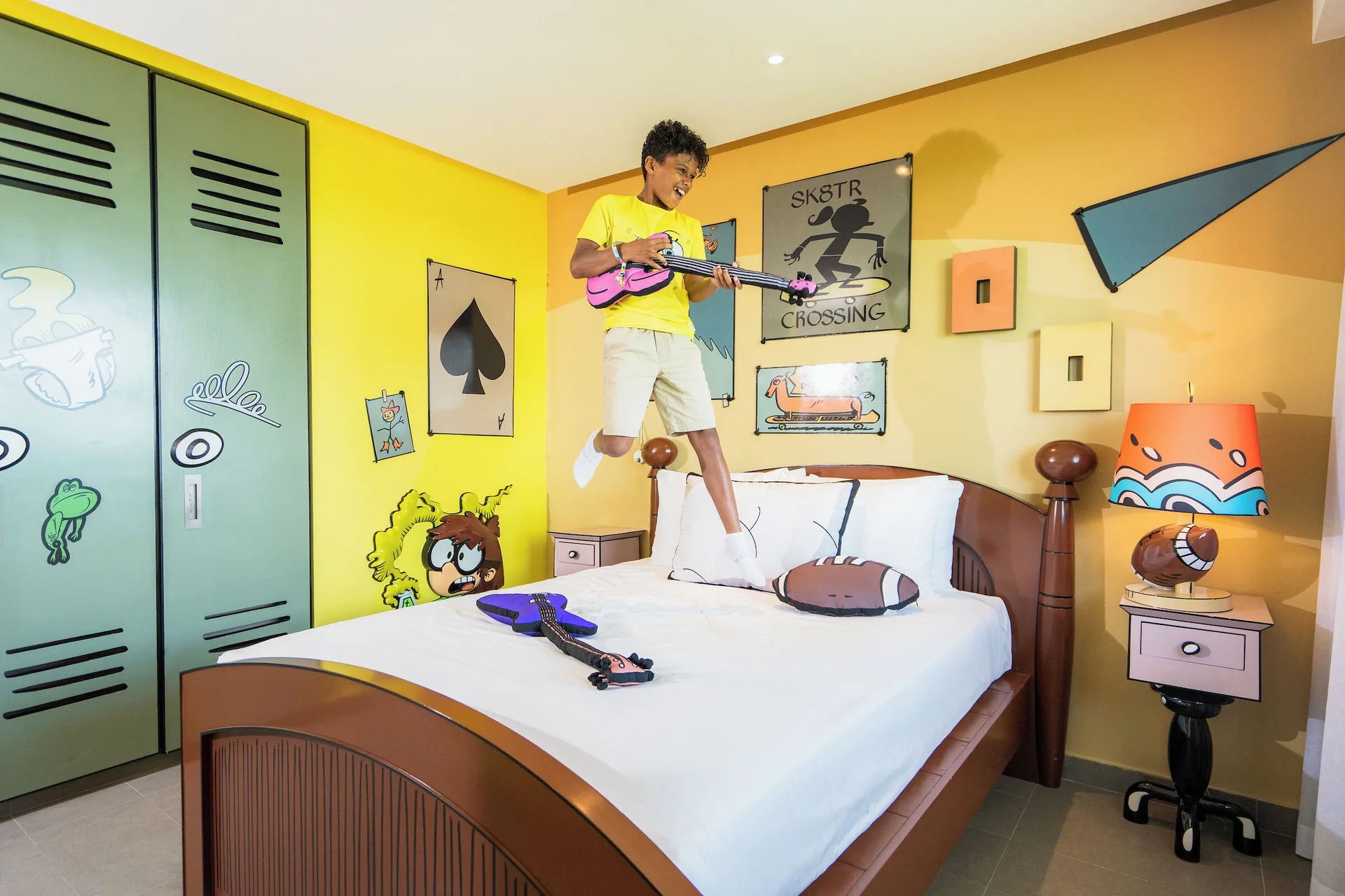 Big Kahuna Suite bedroom with a themed bed and playful wall decor at Nickelodeon Hotels & Resorts Riviera Maya.