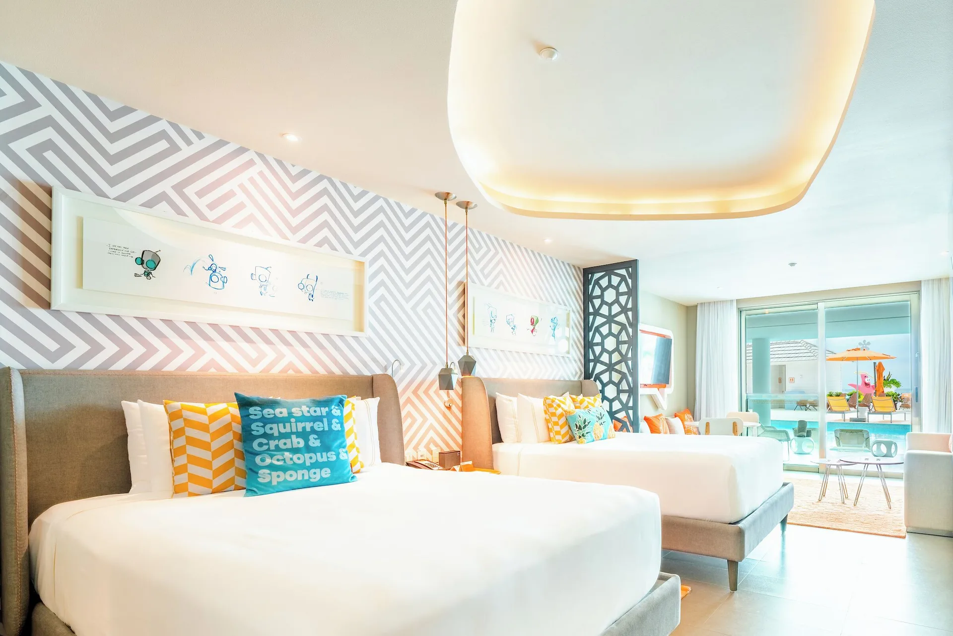 Oceanfront swim-up suite with two beds and patio at Nickelodeon Hotels & Resorts Riviera Maya.