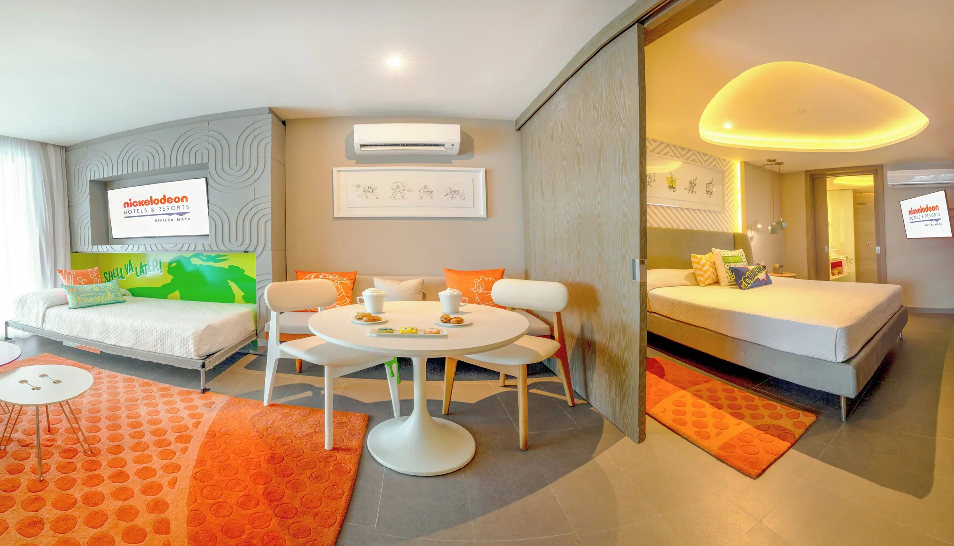 Oceanfront Swim-Up Suite living and bedroom areas at Nickelodeon Hotels & Resorts Riviera Maya.