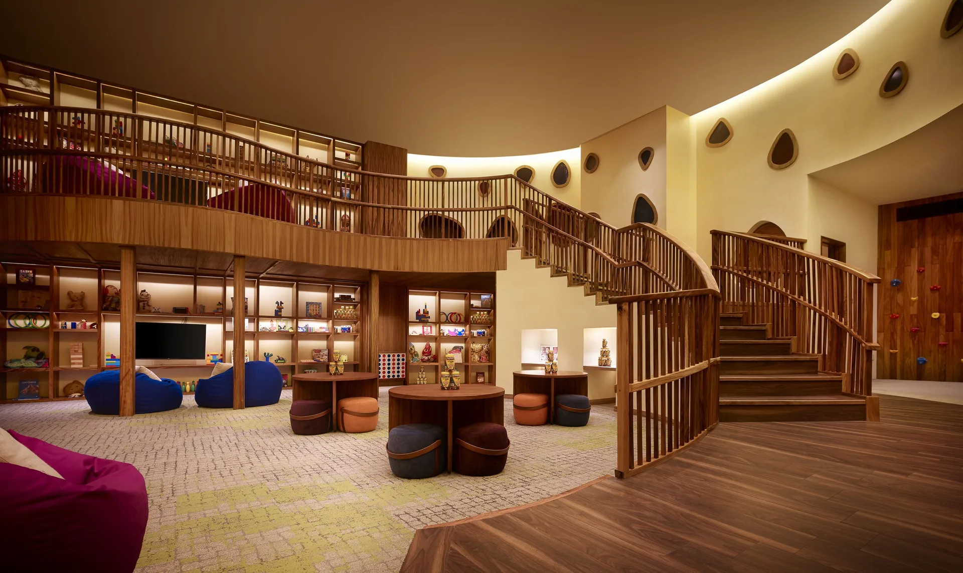 Children’s playroom with curved stairs and colorful seating at Nobu Hotel Los Cabos.