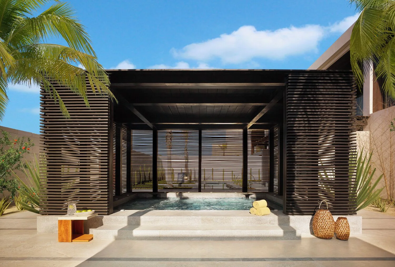 A shaded outdoor hydrotherapy pool pavilion at Nobu Hotel Los Cabos.