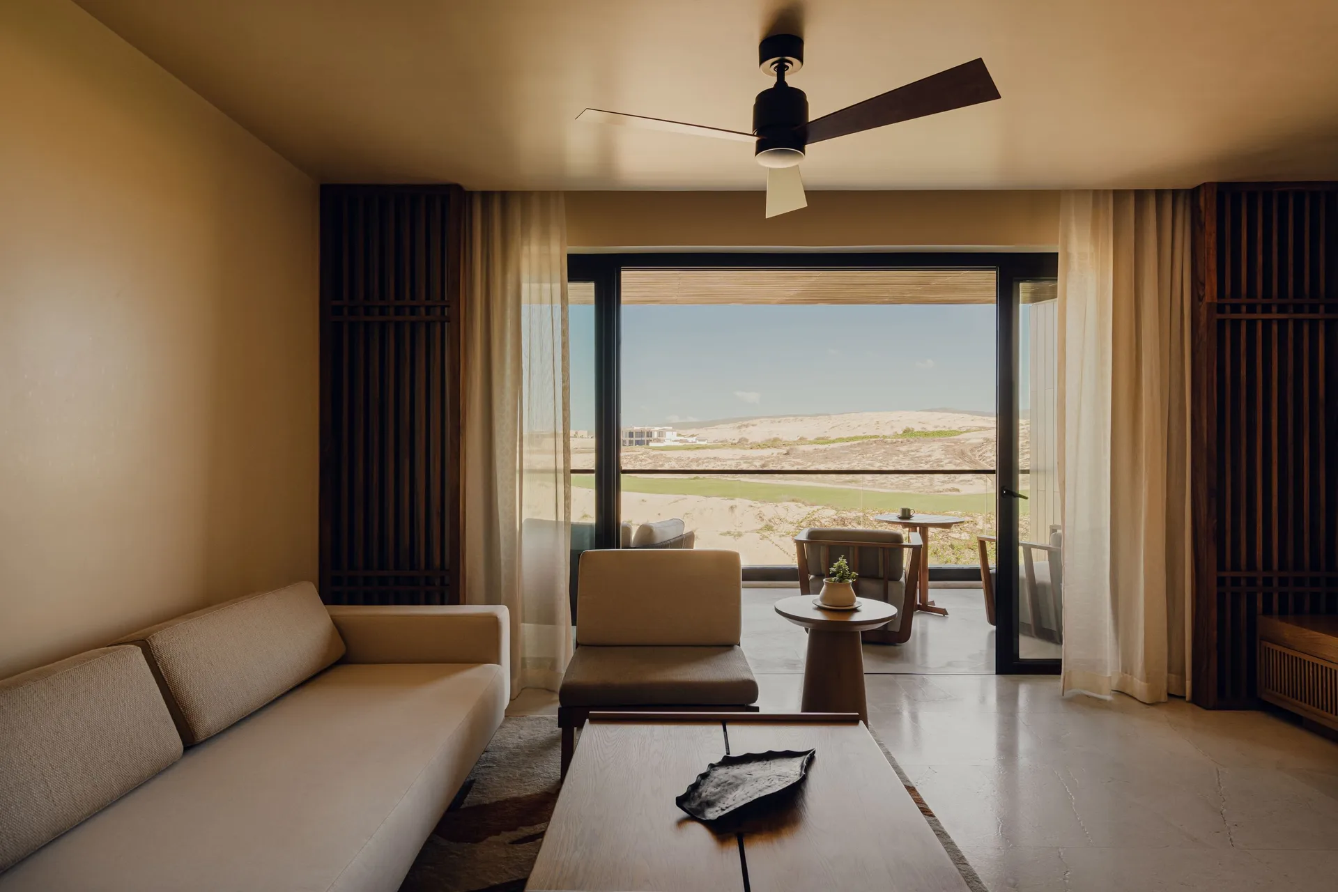 Hikari One Bedroom living area opening to the balcony at Nobu Hotel Los Cabos.