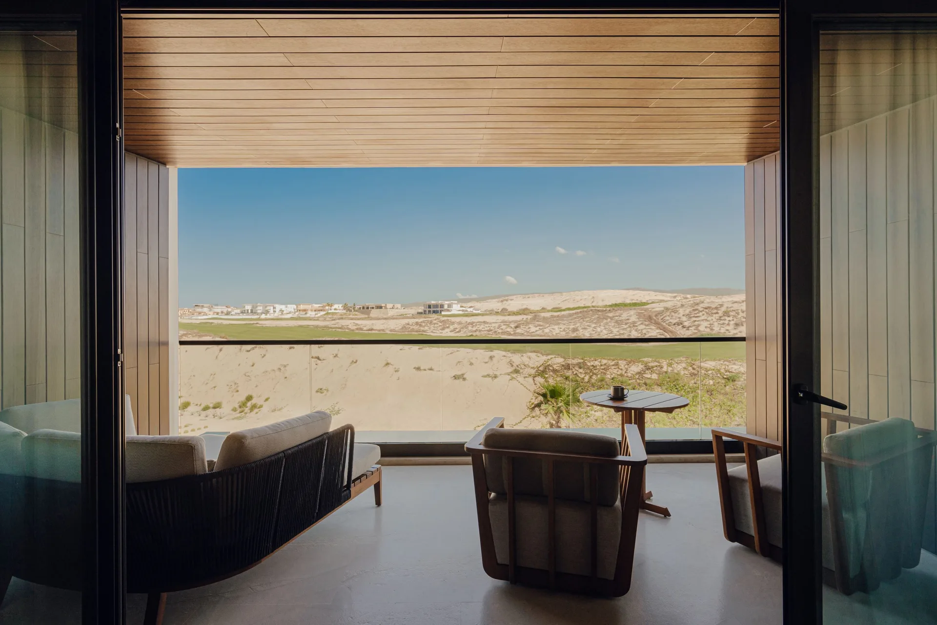 Hikari One Bedroom terrace seating and desert view at Nobu Hotel Los Cabos.