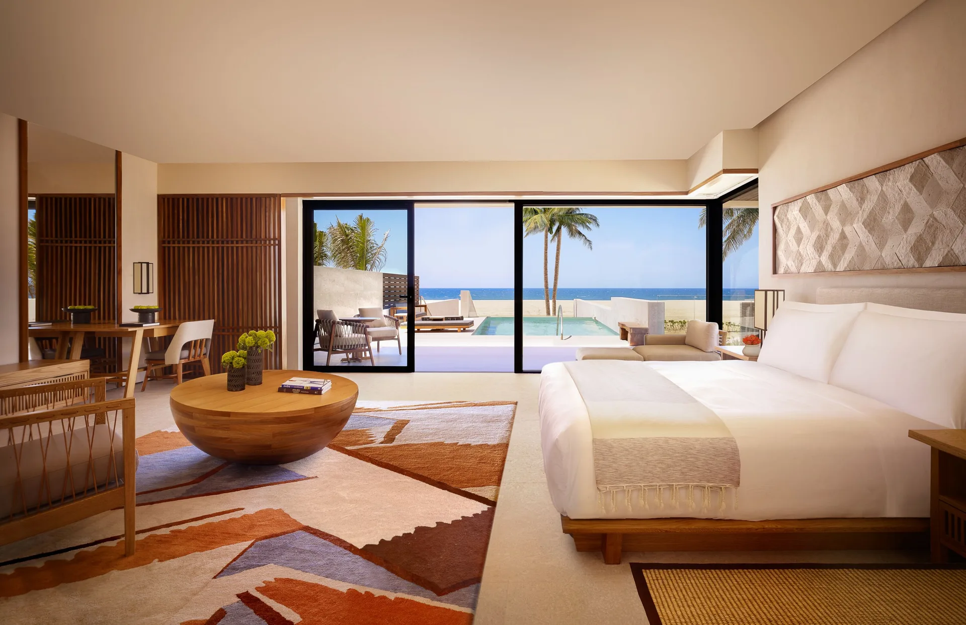 King bed in an oceanfront junior room at Nobu Hotel Los Cabos with private pool and ocean view.