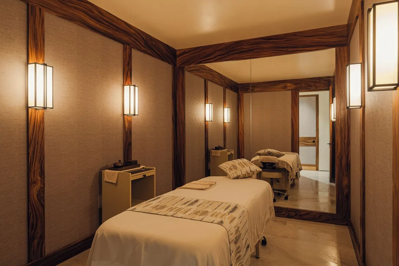 Massage room with treatment table in Kogane Penthouse at Nobu Hotel Los Cabos.