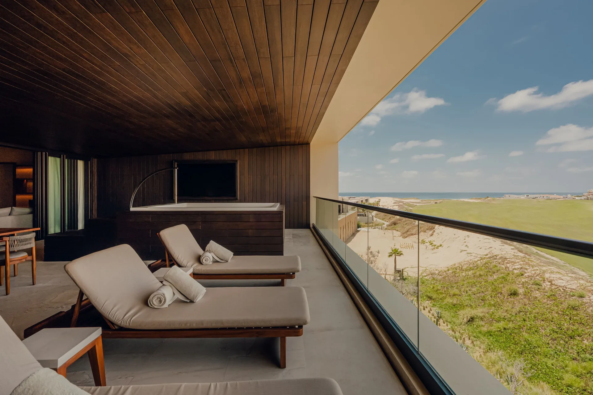 Ocean-view terrace loungers in Kogane Penthouse at Nobu Hotel Los Cabos.