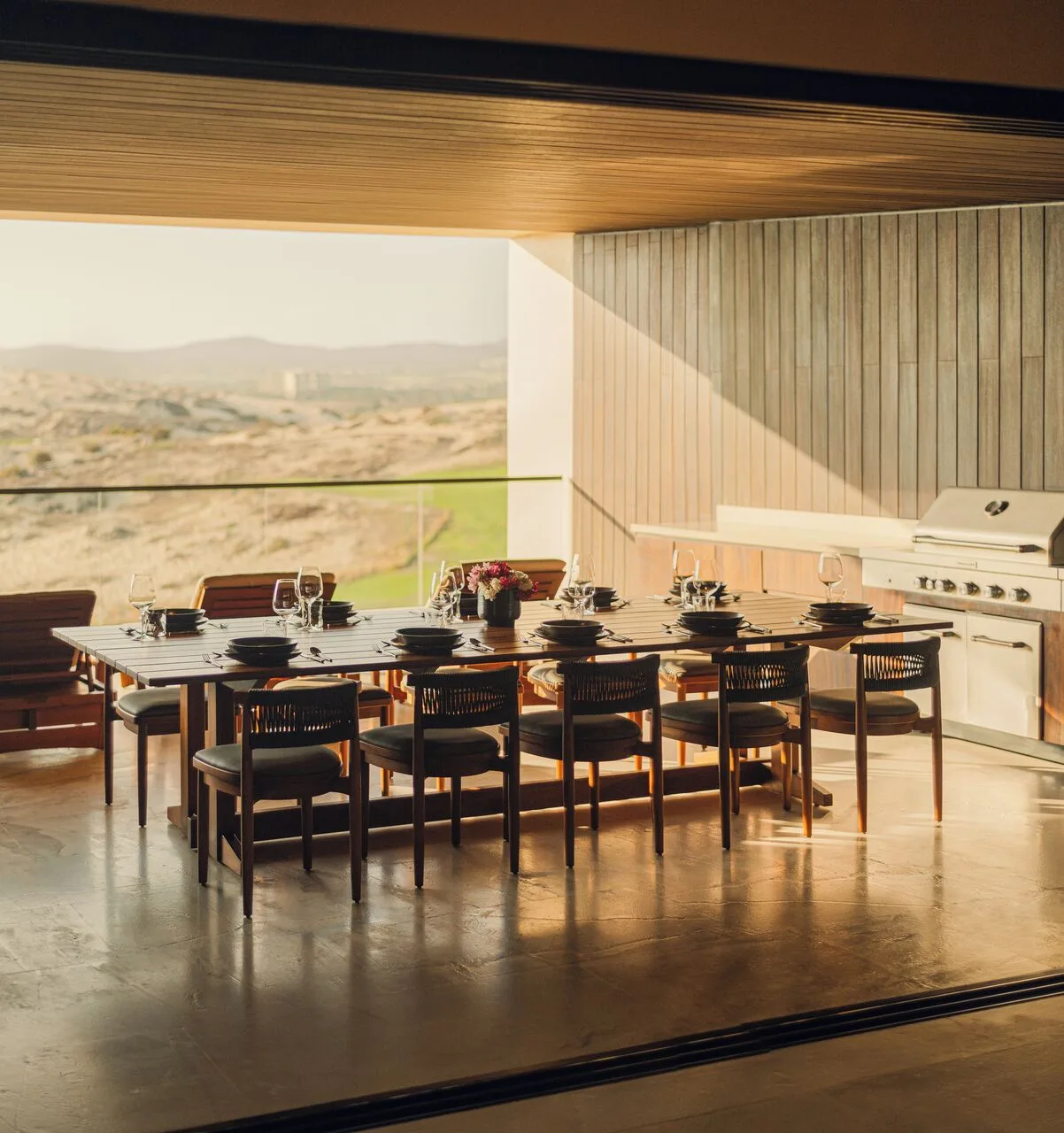 Set terrace dining table and grill in Kogane Penthouse at Nobu Hotel Los Cabos.