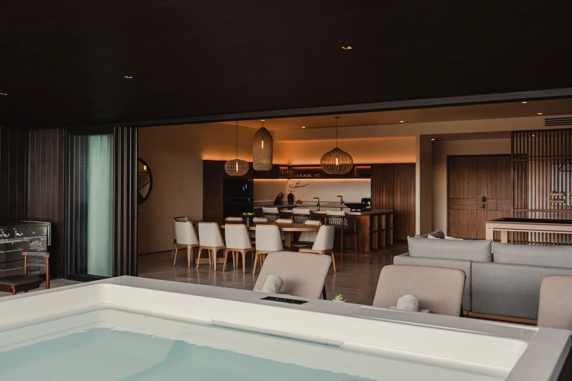 Kogane Penthouse terrace spa tub beside indoor dining and lounge at Nobu Hotel Los Cabos.