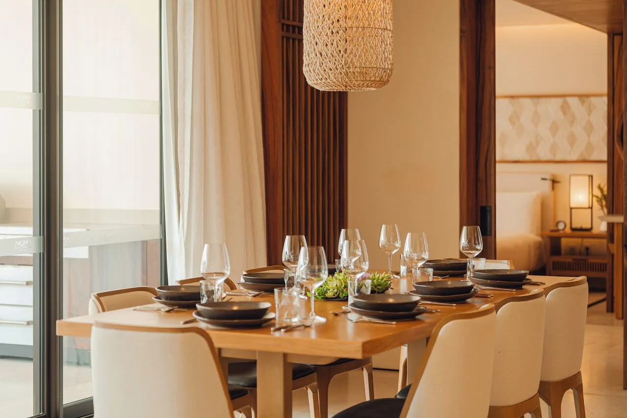 Sakyu 3 Bedrooms dining table set with glassware at Nobu Hotel Los Cabos.