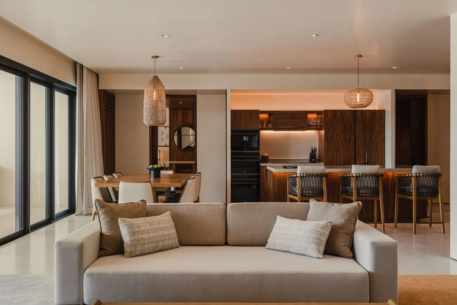 Sakyu 3 Bedrooms living room, dining area, and kitchen at Nobu Hotel Los Cabos.