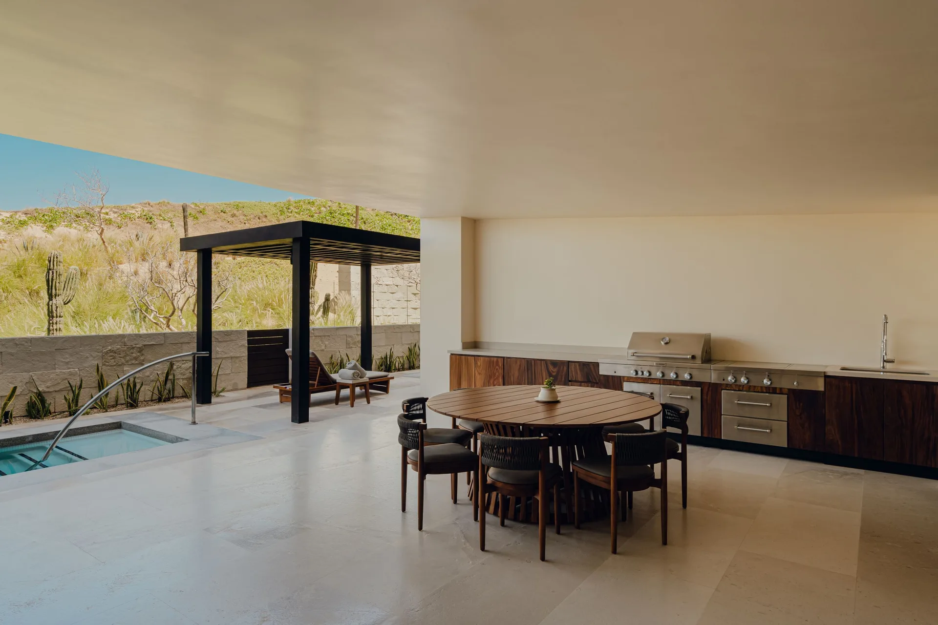 Sakyu 3 Bedrooms outdoor dining area with grill beside the pool at Nobu Hotel Los Cabos.