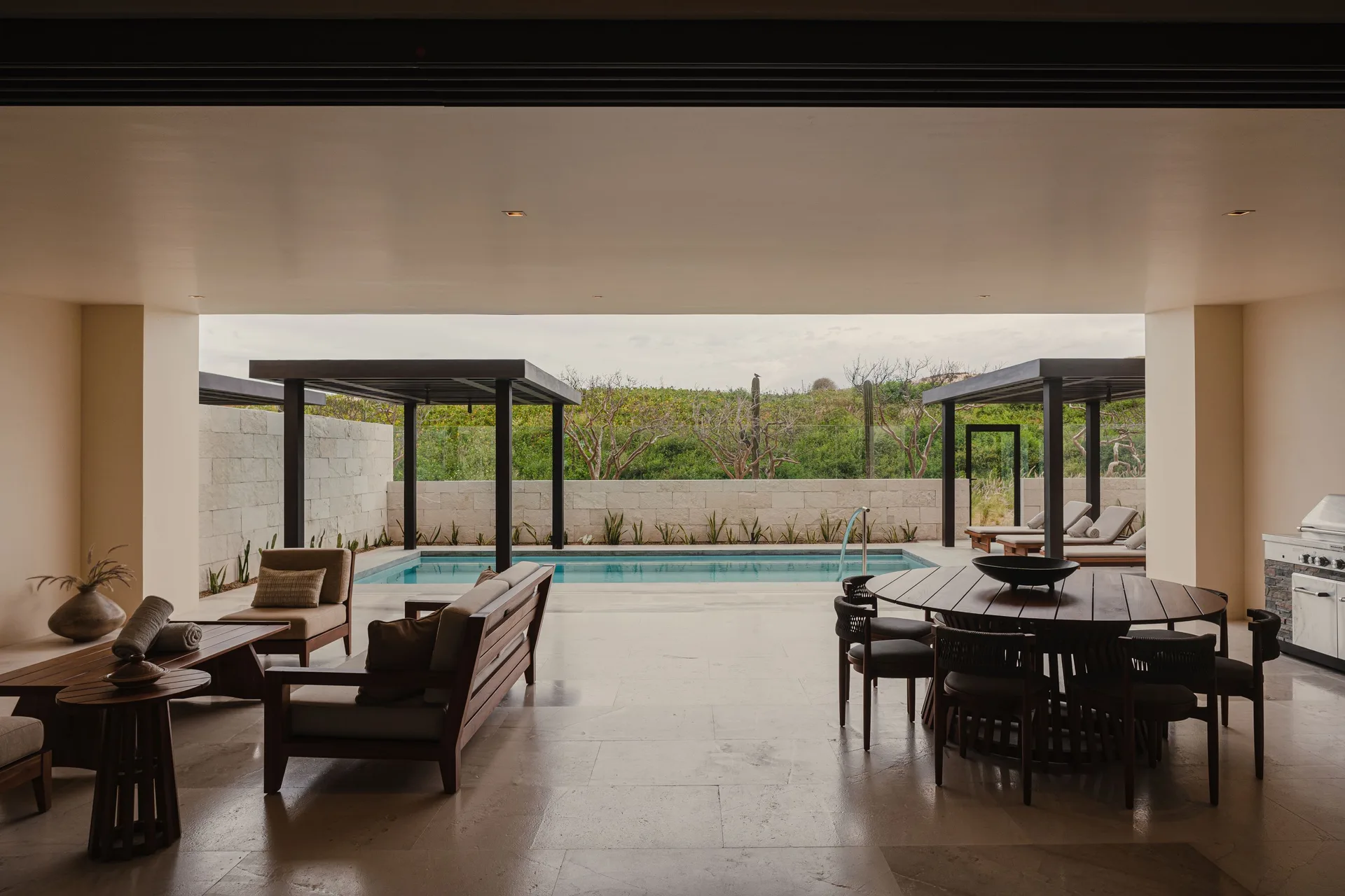 Sakyu 3 Bedrooms terrace lounge and dining areas facing the private pool at Nobu Hotel Los Cabos.