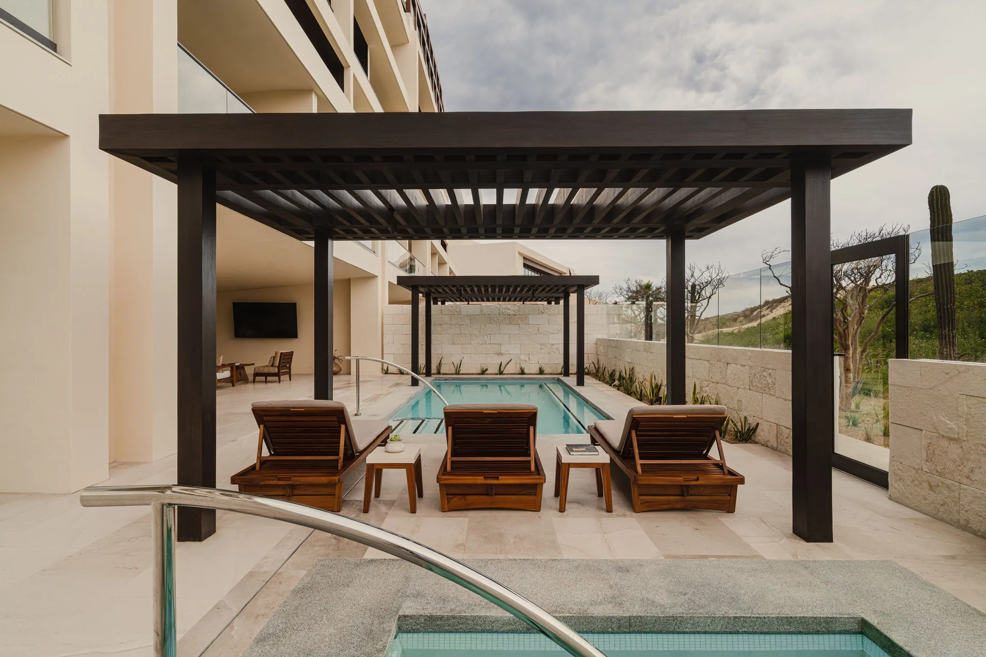 Sakyu 3 Bedrooms terrace pool with loungers and pergolas at Nobu Hotel Los Cabos.