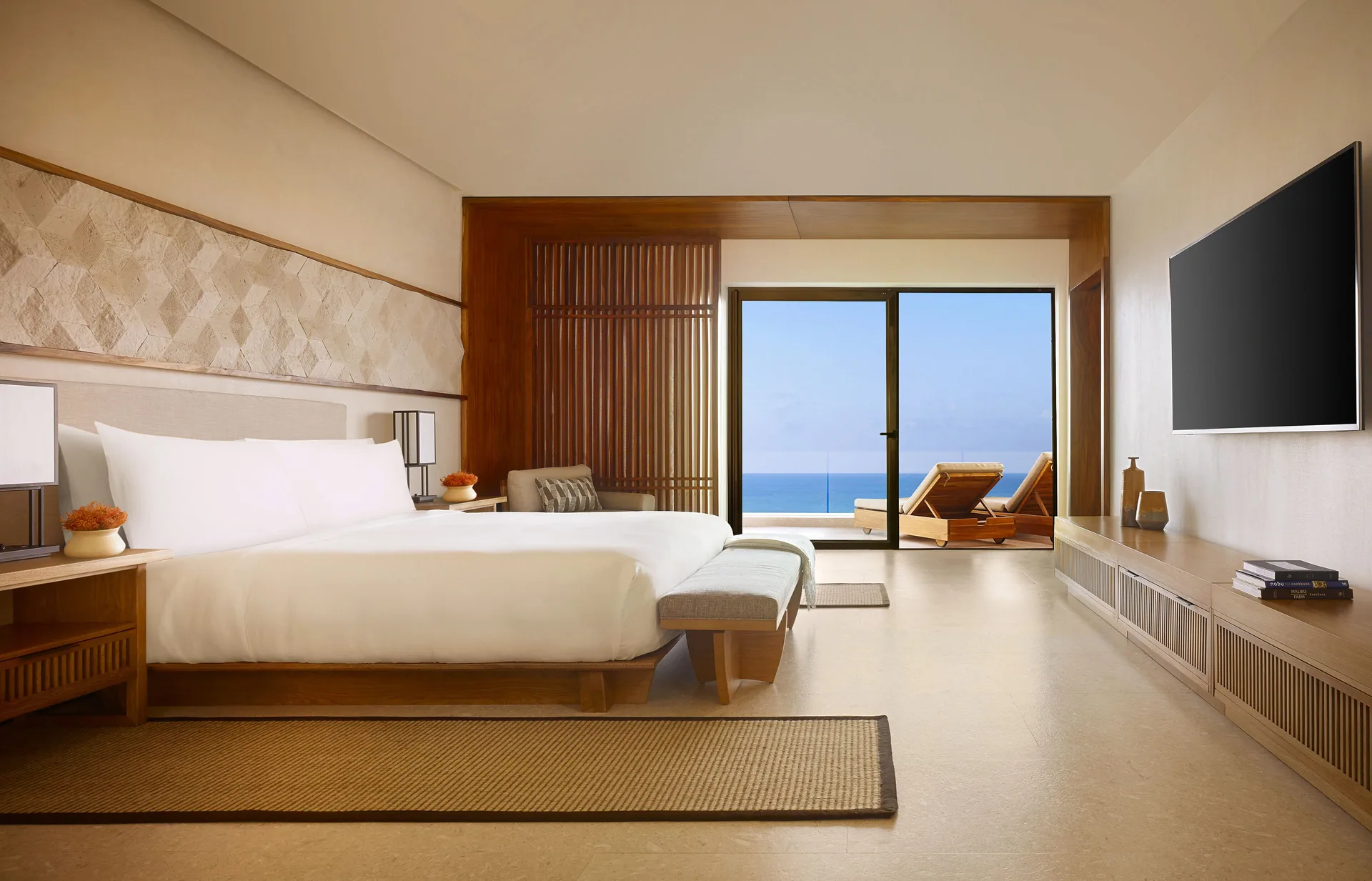 Ocean View Suite bedroom with king bed and terrace at Nobu Hotel Los Cabos.