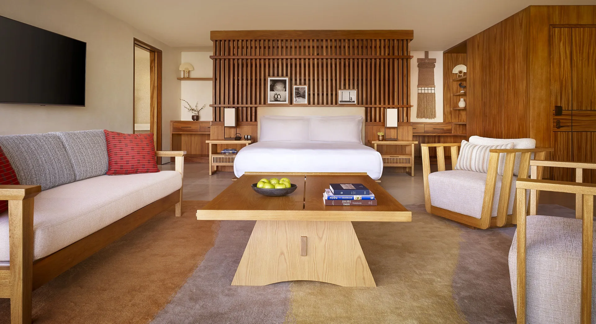 Suite Ocean View king bed and sitting area at Nobu Hotel Los Cabos.