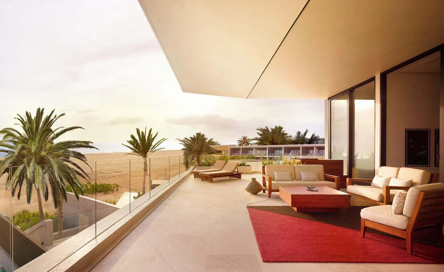 Oceanfront suite terrace with lounge seating and ocean view at Nobu Hotel Los Cabos.