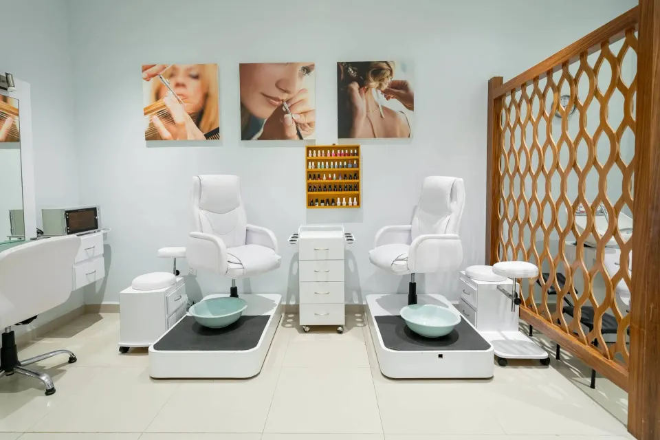 Two white pedicure stations sit in a bright spa room at Occidental Nuevo Vallarta.