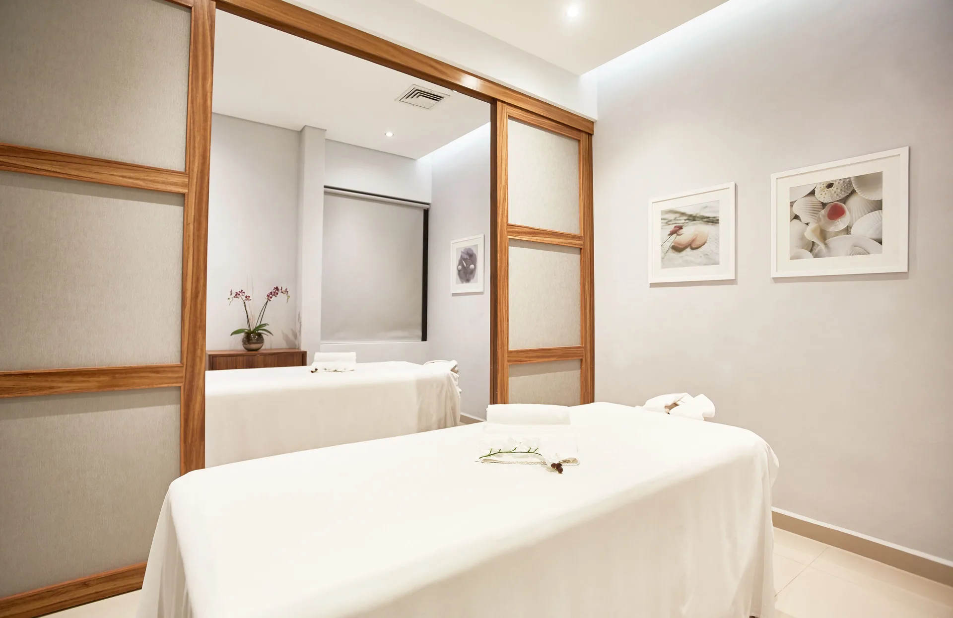 White massage tables are prepared in a spa treatment room at Occidental Nuevo Vallarta.