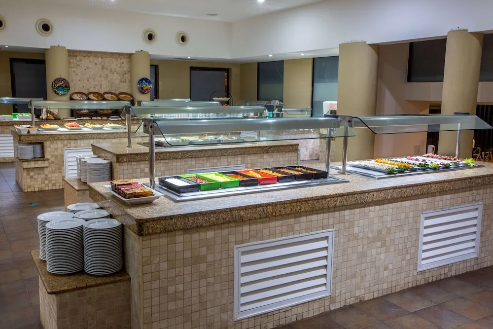 Buffet counters with plates and chilled displays are set up at Occidental Nuevo Vallarta.