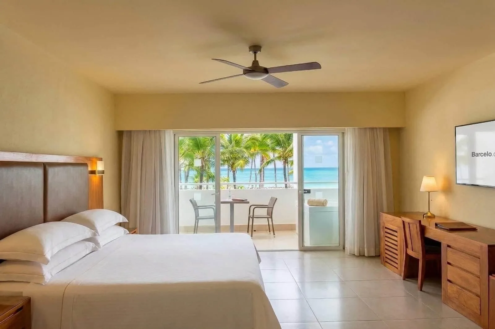 Oceanfront Junior Studio Suite with king bed and balcony view at Occidental Punta Cana.