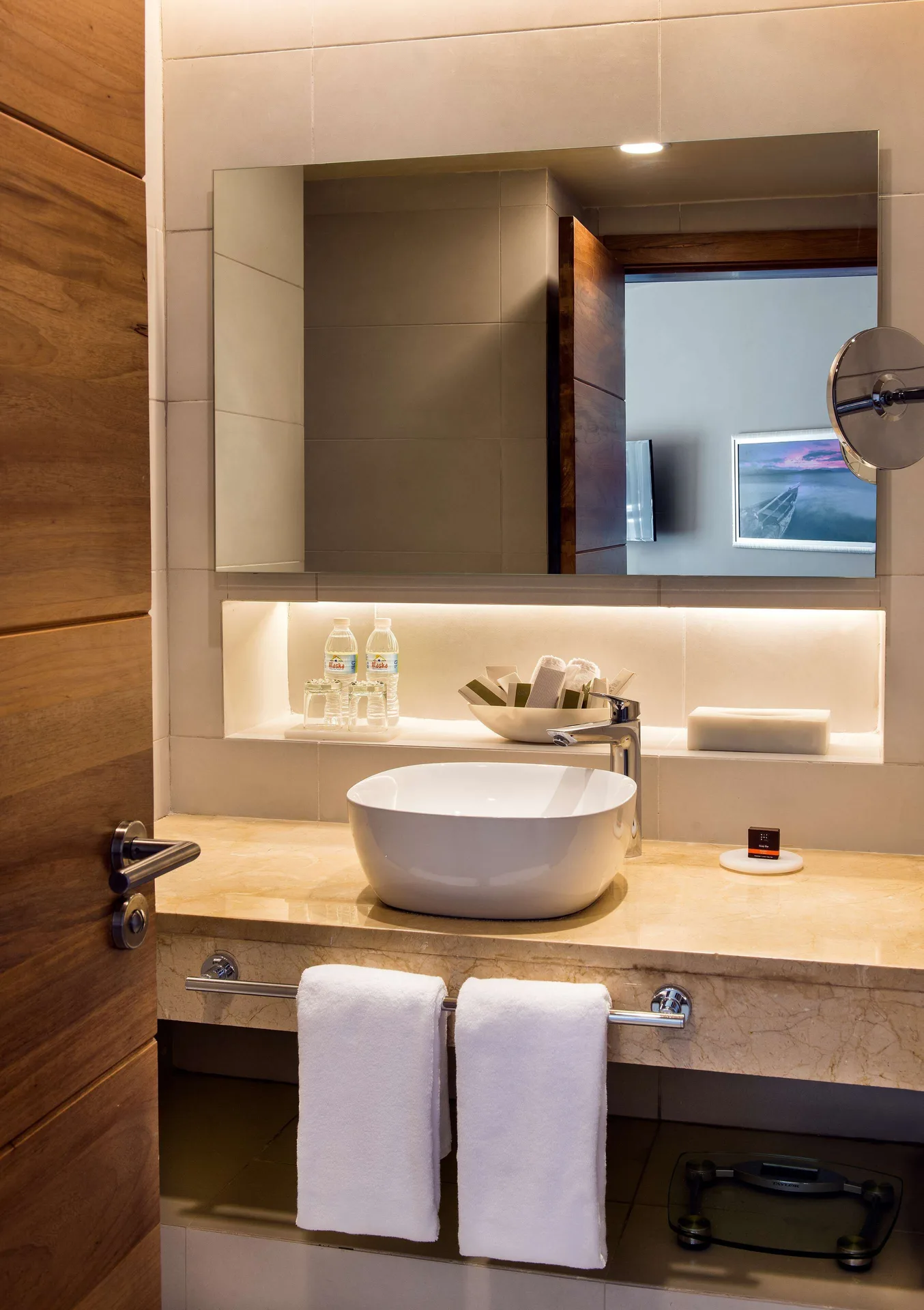 Superior Room bathroom vanity with vessel sink and mirror at Occidental Punta Cana.