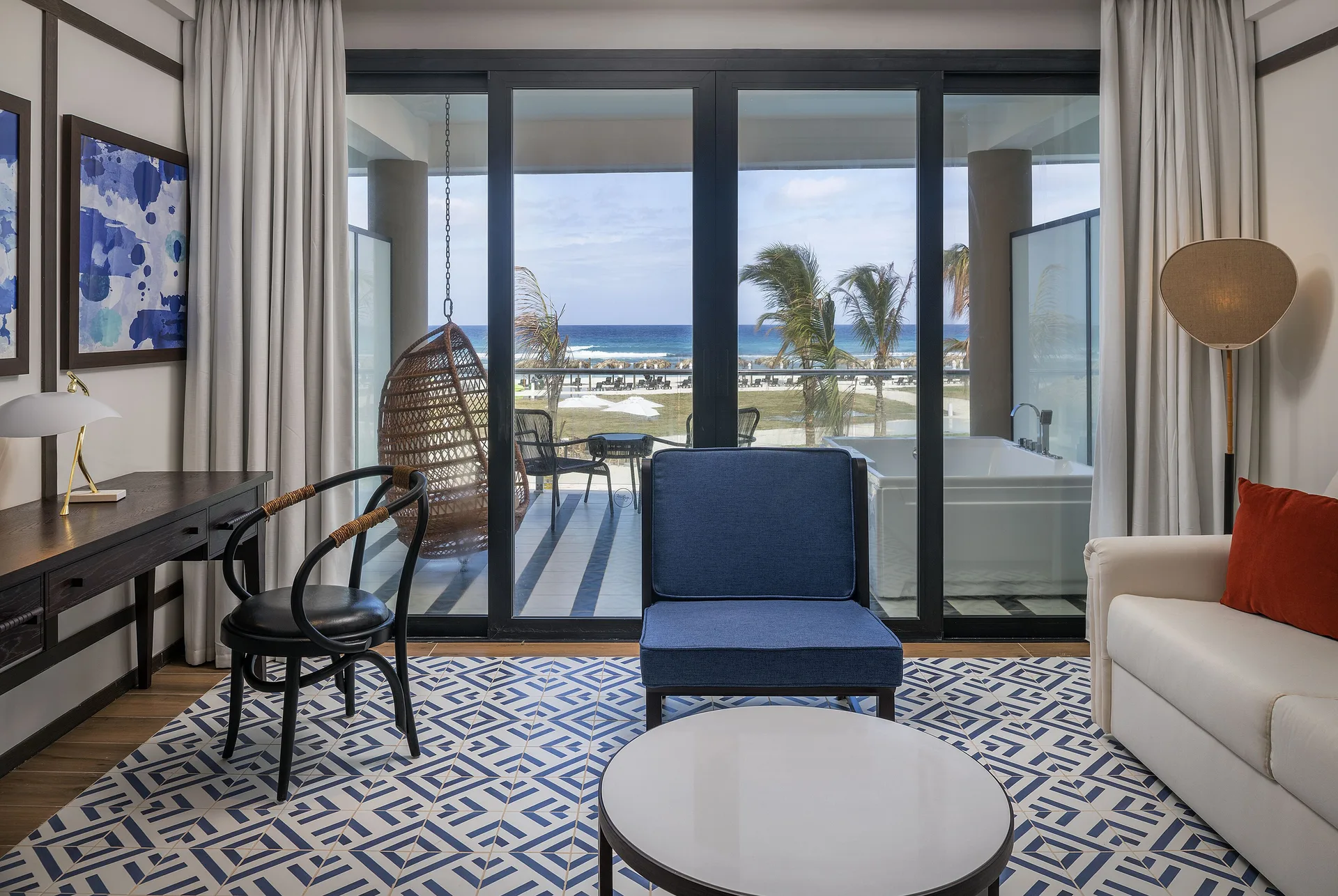 Privilege Junior Suite Nature View balcony doors and seating at Ocean Coral Spring.