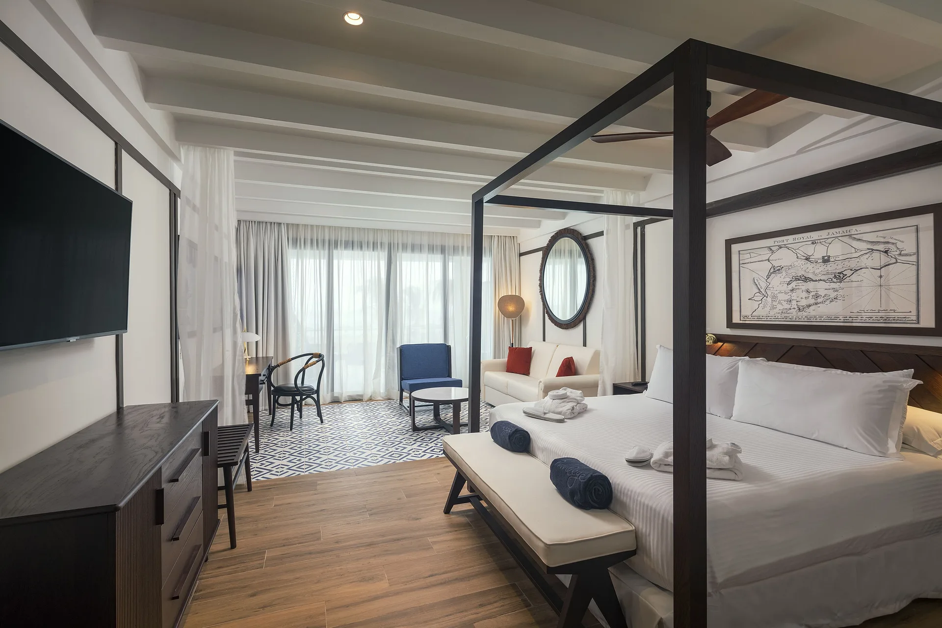 Privilege Junior Suite Nature View with canopy bed and sitting area at Ocean Coral Spring.