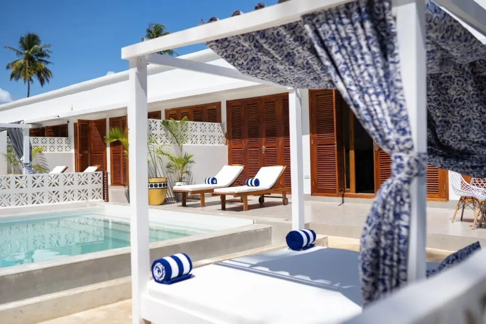Private pool terrace with cabana daybed and loungers at Orient Beach Hotel.