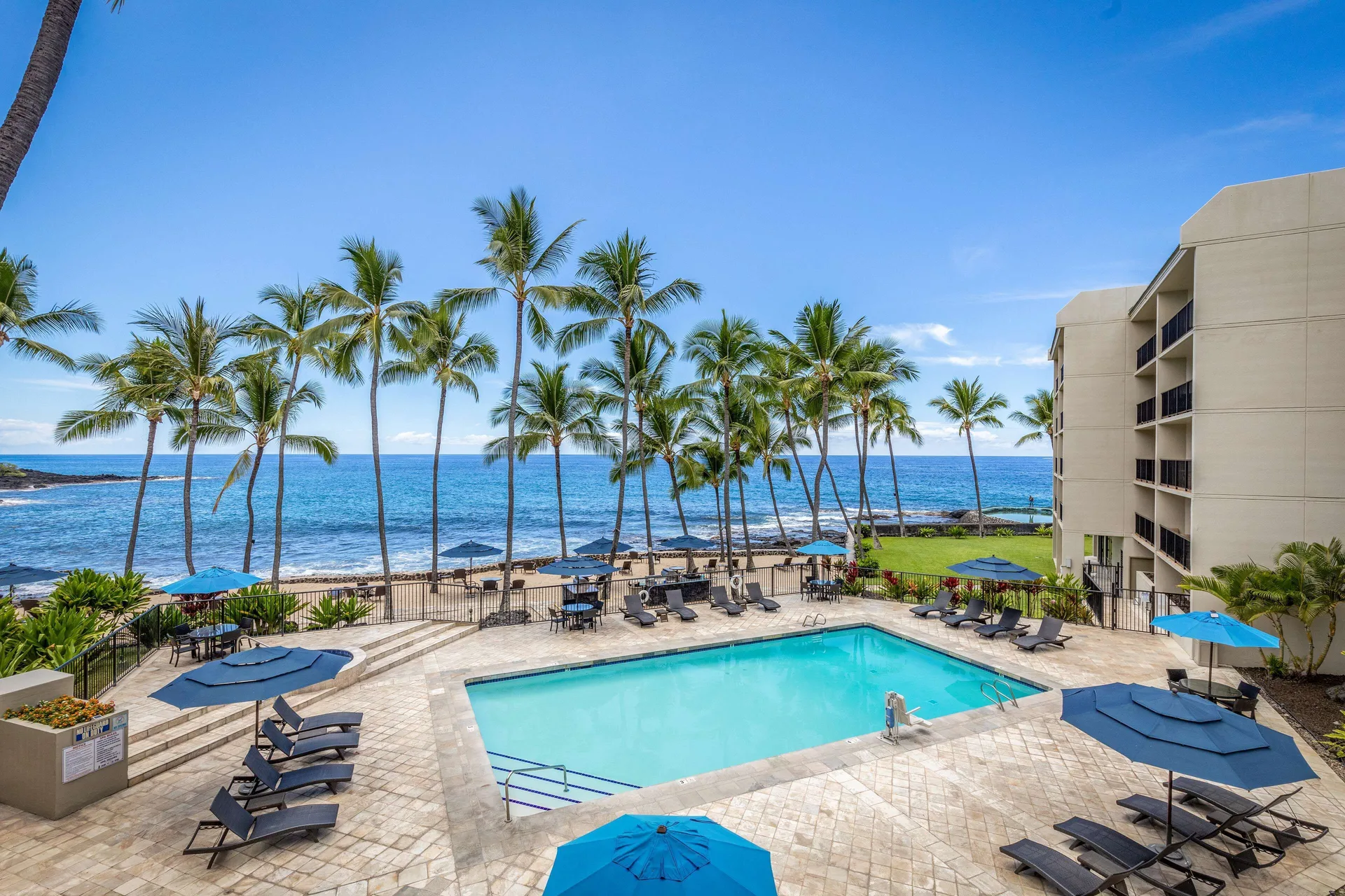 Aston Kona by the Sea oceanfront condominium resort with spacious suites and lava-rock shoreline views
