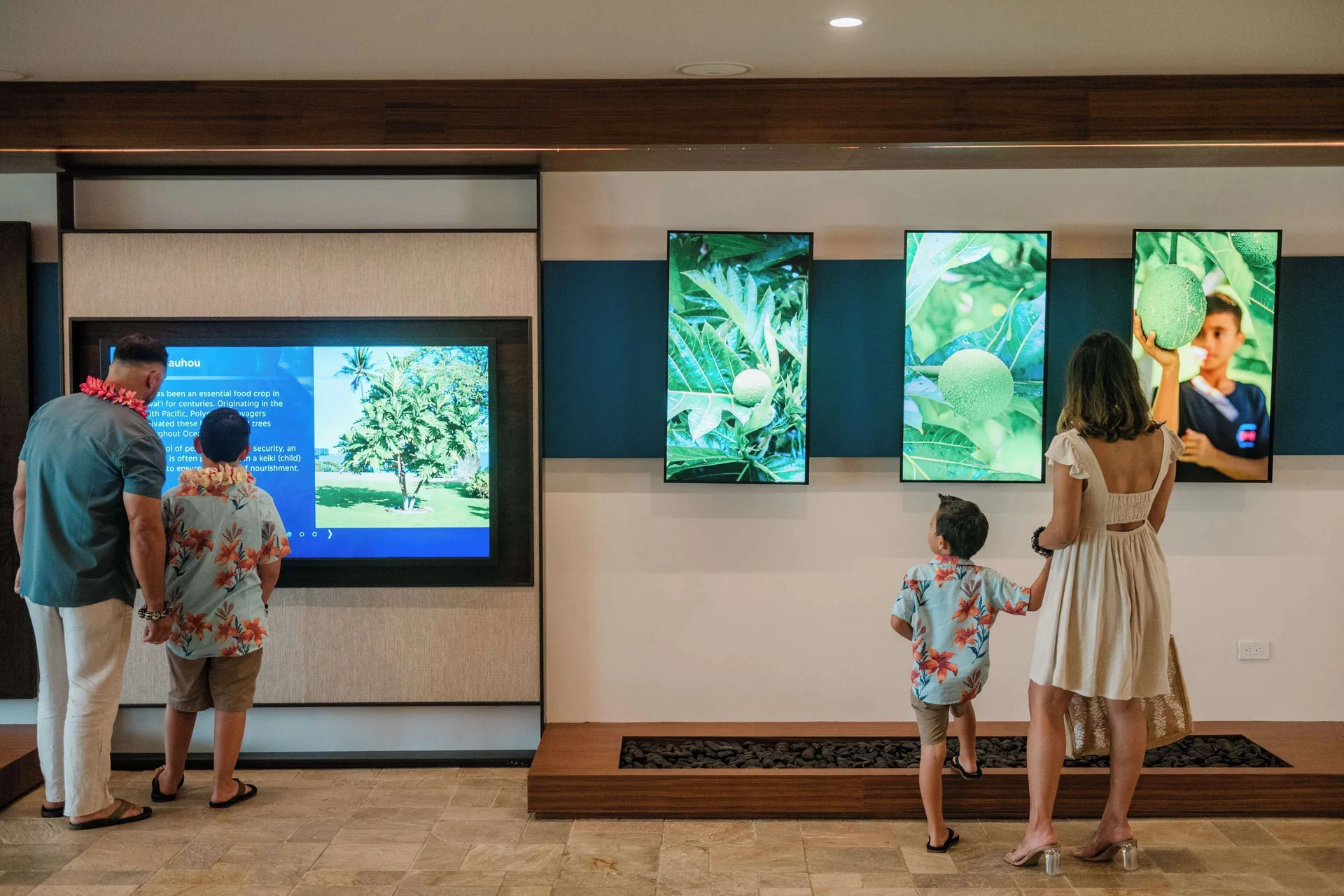 Family viewing interactive cultural displays at Outrigger Kona Resort and Spa.