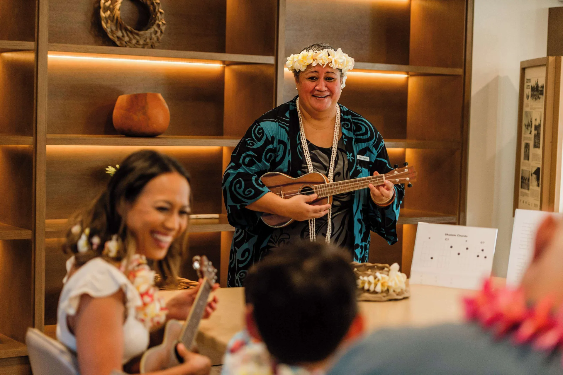 Ukulele lesson with a smiling instructor at Outrigger Kona Resort and Spa.