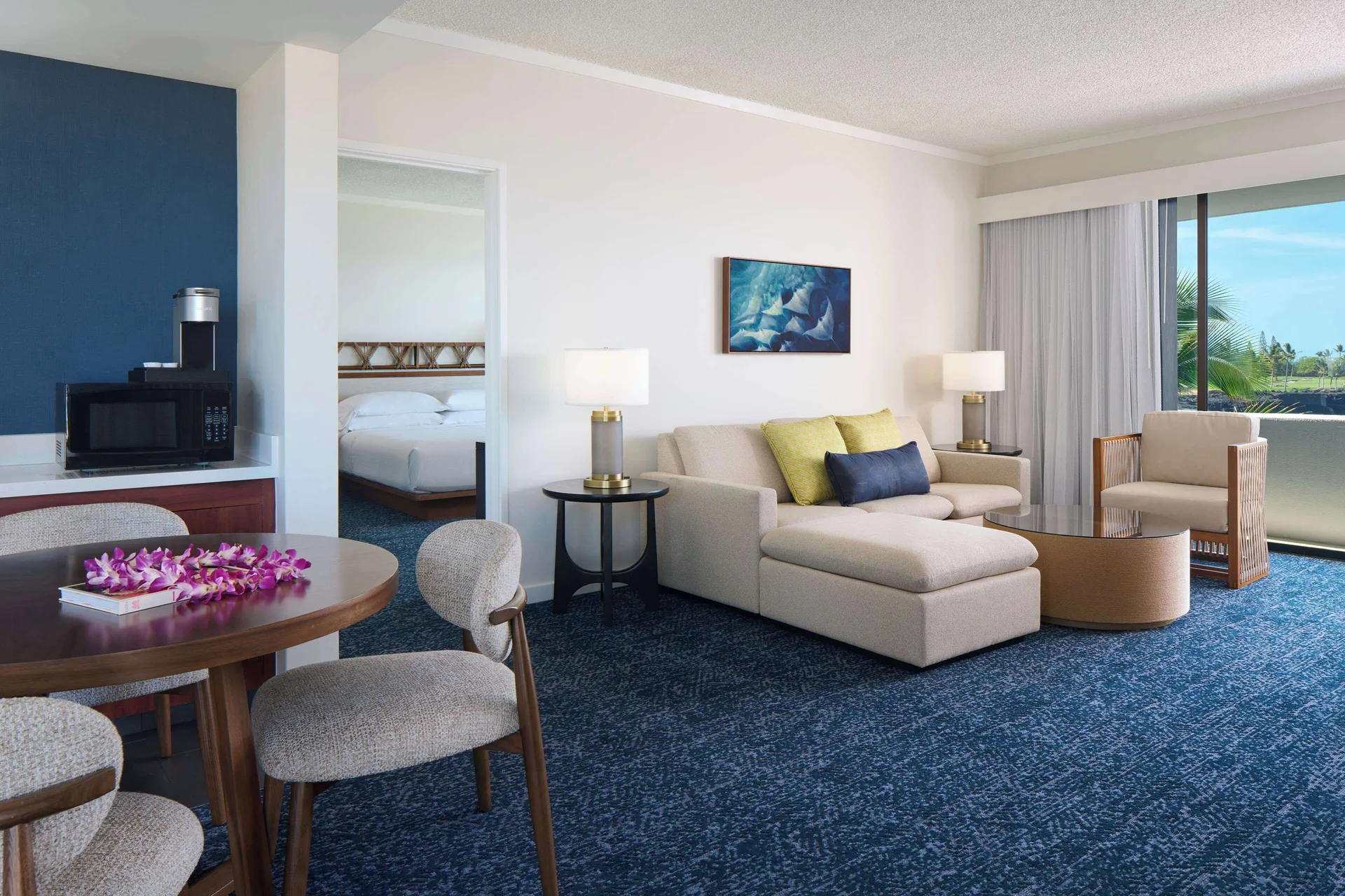 Deluxe oceanfront club suite living area with sofa bed at Outrigger Kona Resort and Spa.