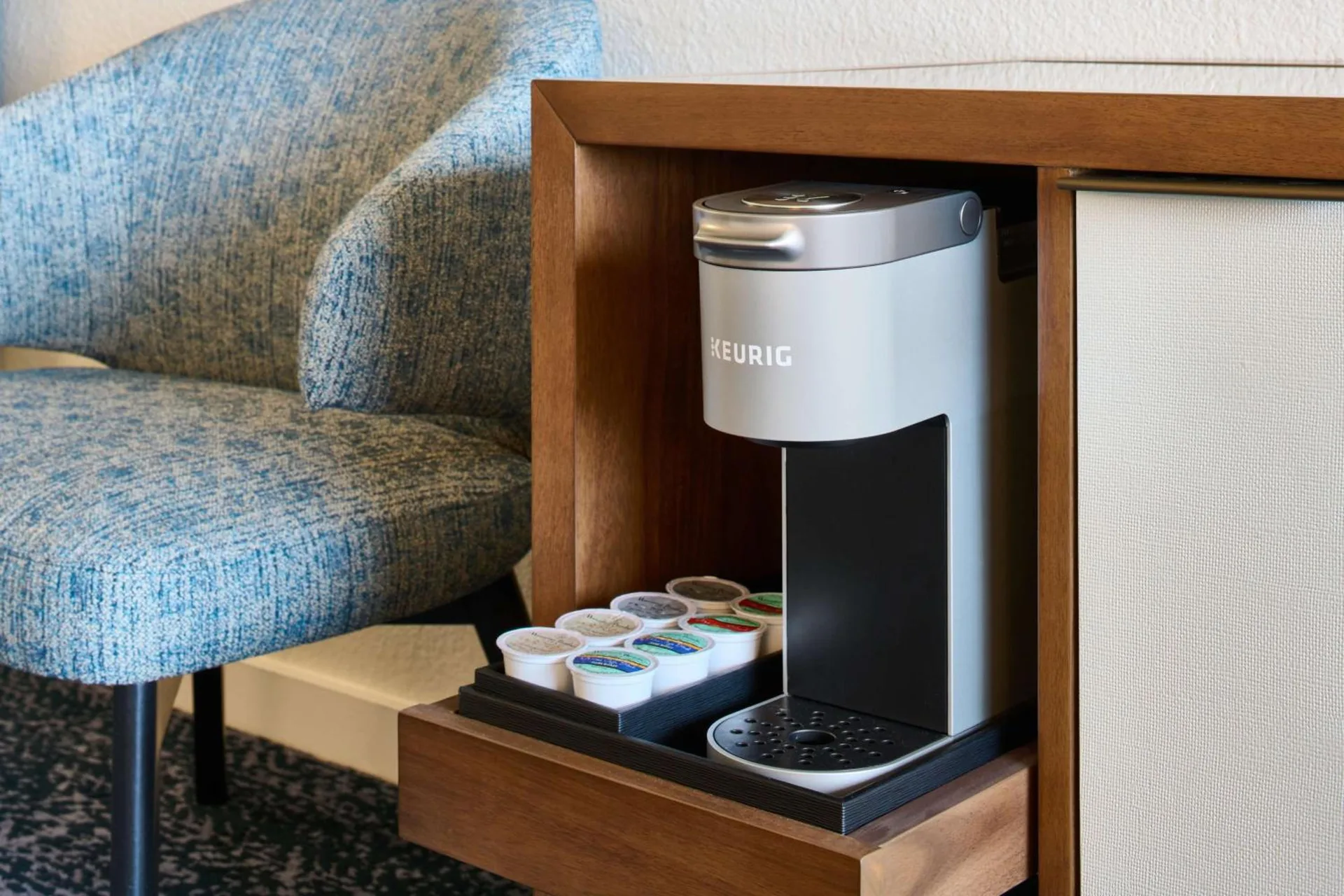 Resort View Room coffee station in a wood cabinet at Outrigger Kona Resort and Spa.