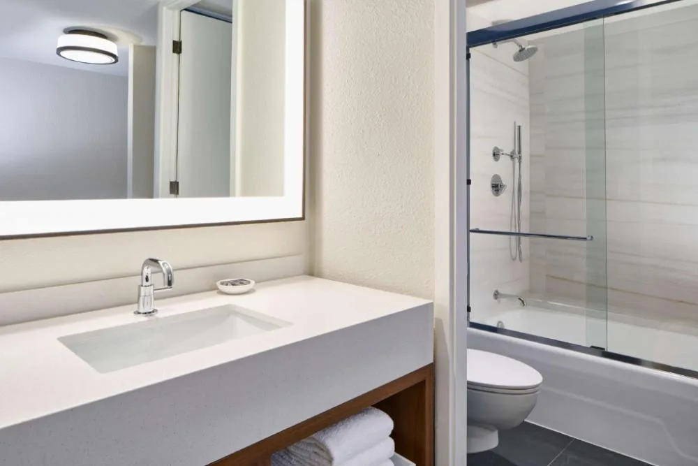 Resort View bathroom vanity and tub shower at Outrigger Kona Resort and Spa.