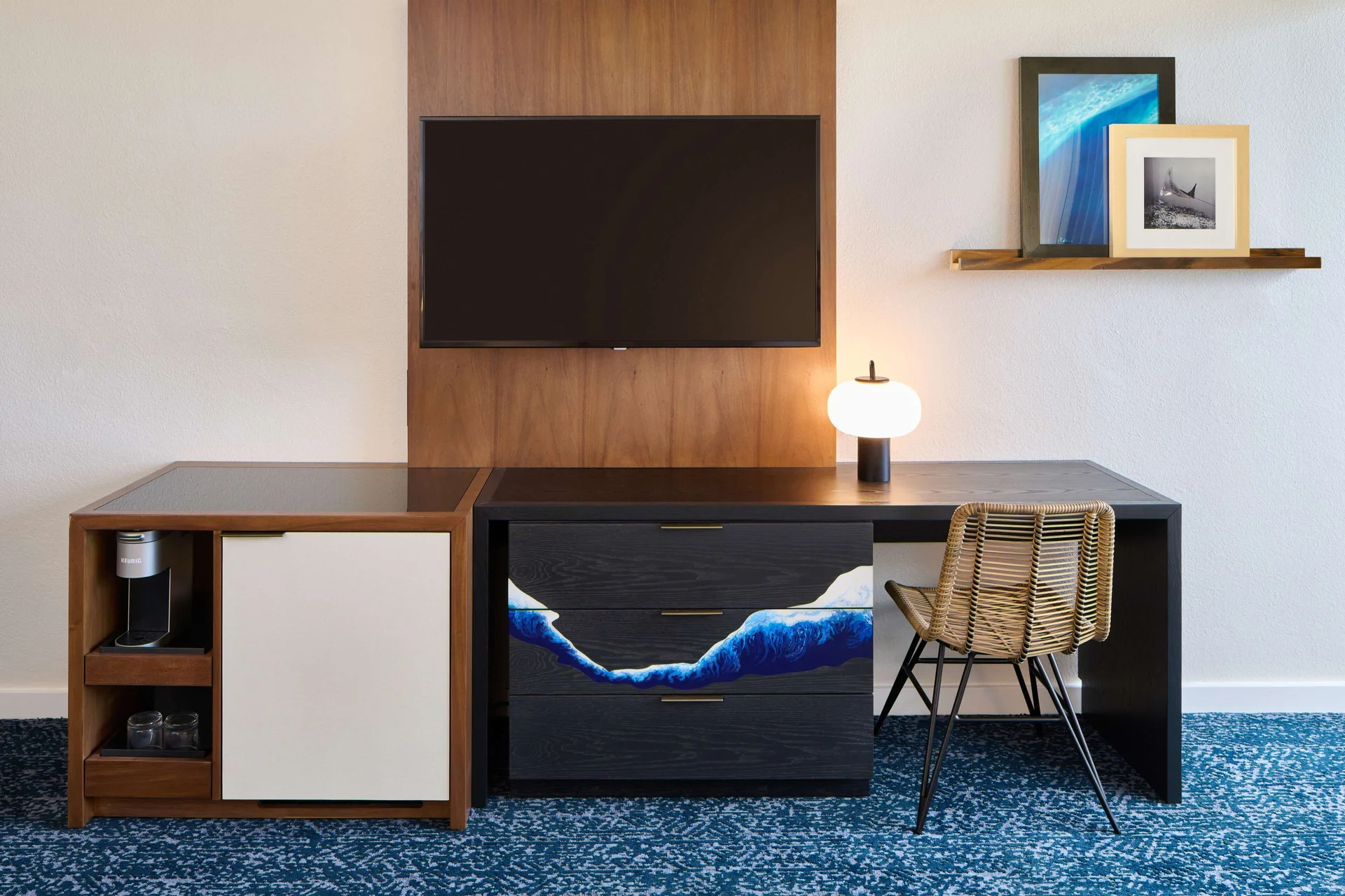 Guest room desk, TV, dresser, and coffee station at Outrigger Kona Resort and Spa.