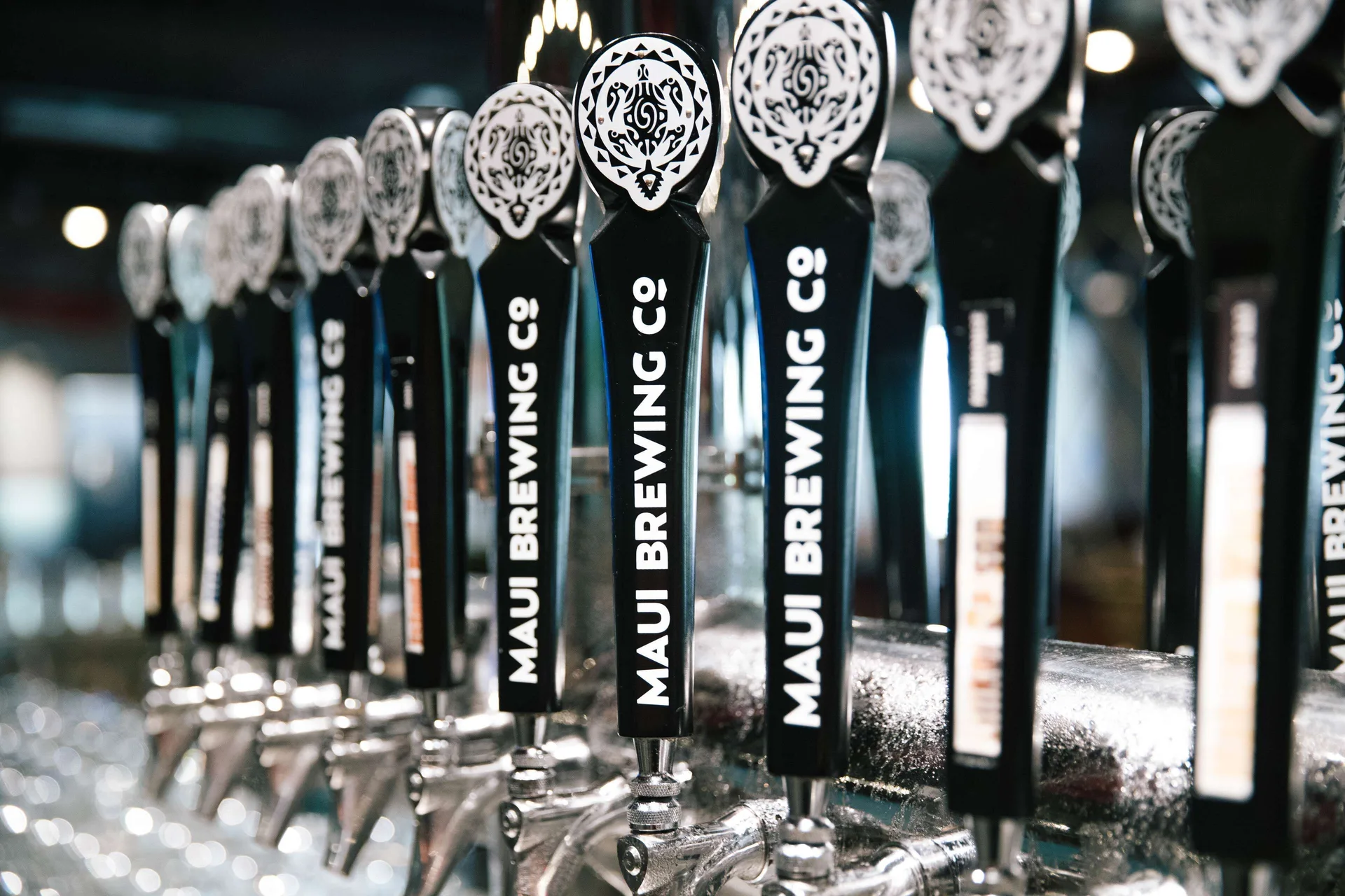 Maui Brewing Co. tap handles lined up at OUTRIGGER Waikiki Beachcomber Hotel.