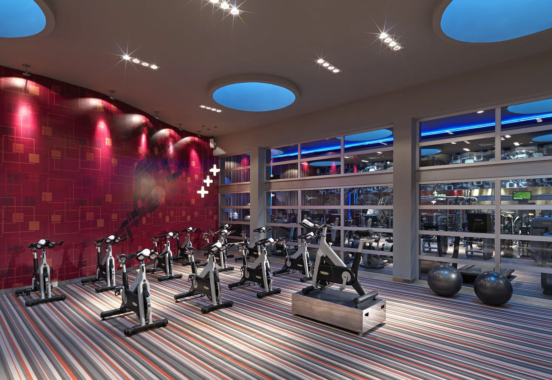 Indoor cycling studio with rows of bikes at Paradisus La Perla Riviera Maya.