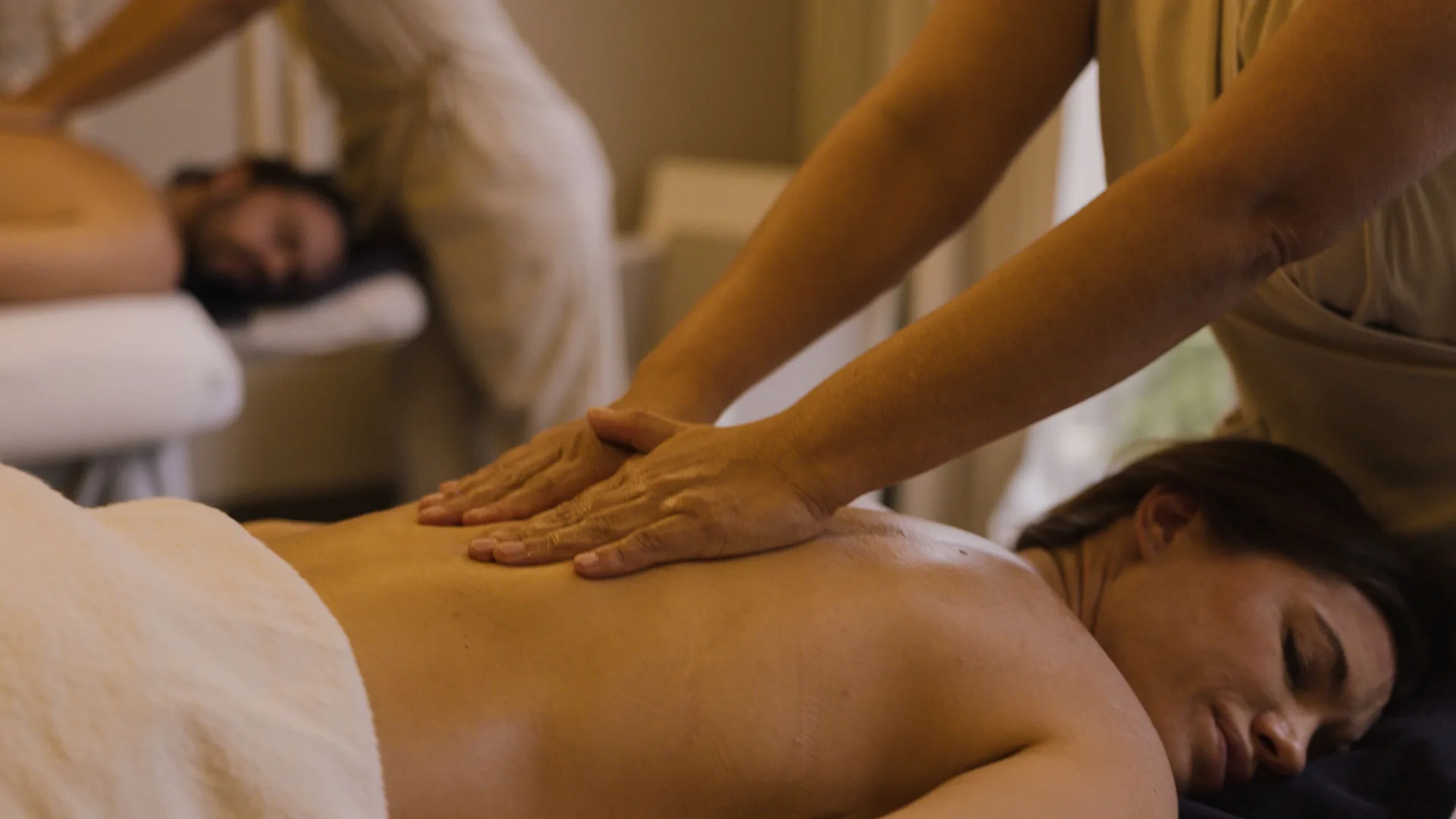 A guest receives a back massage in the spa at Paradisus La Perla Riviera Maya.