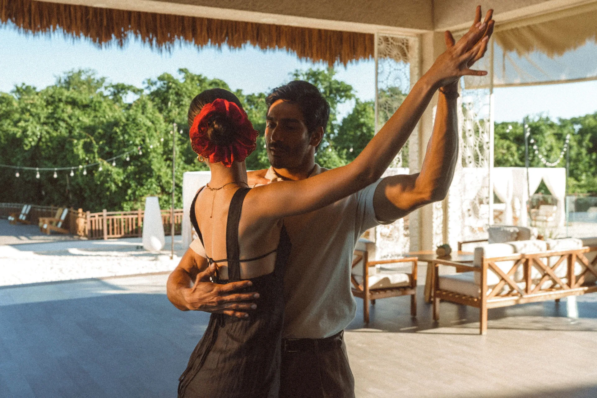 A couple dances on an open terrace at Paradisus La Perla Riviera Maya.