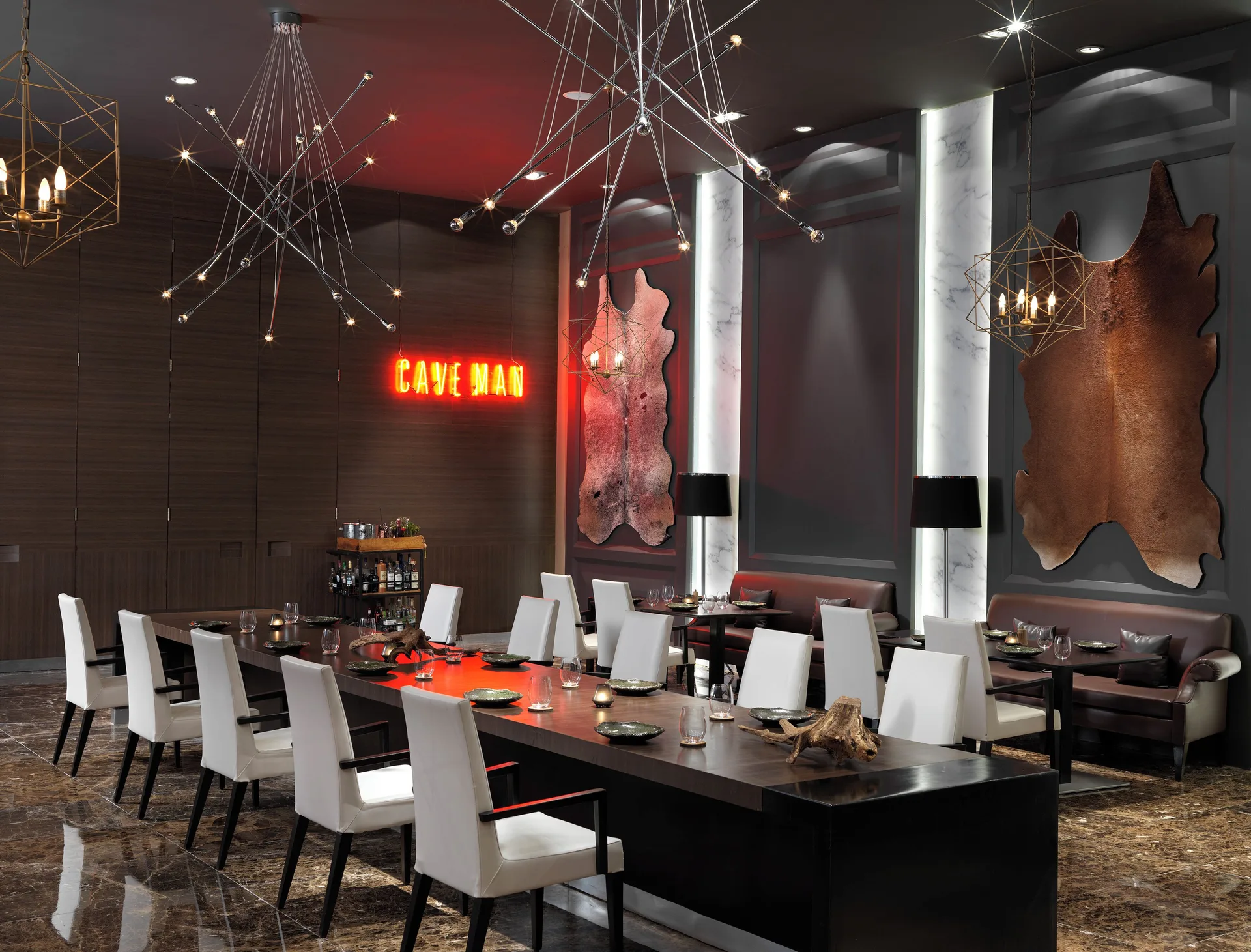 Sal Steak Cave dining room with neon Cave Man sign at Paradisus La Perla Riviera Maya.