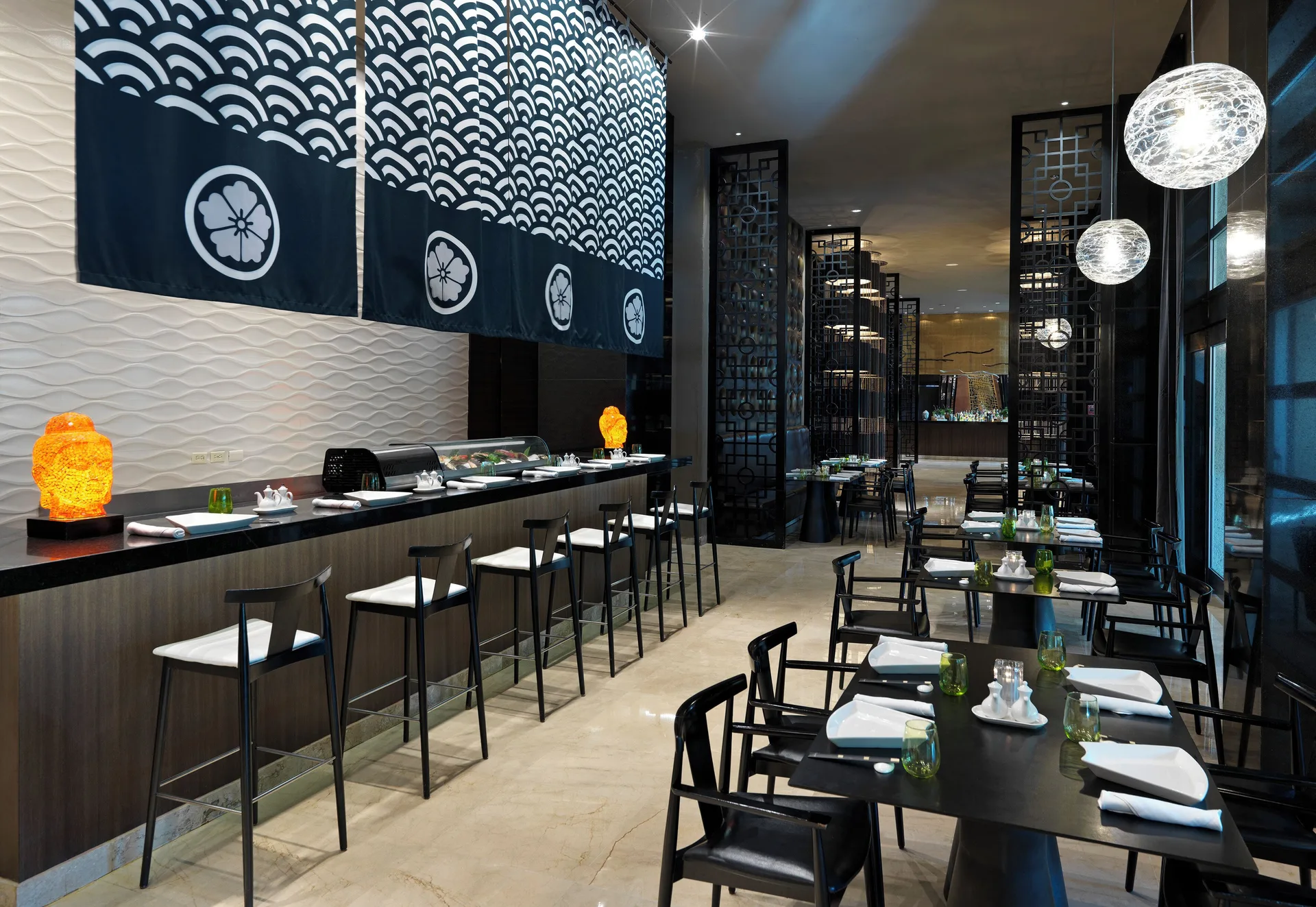 Sushi counter and dining tables at Paradisus La Perla Riviera Maya.