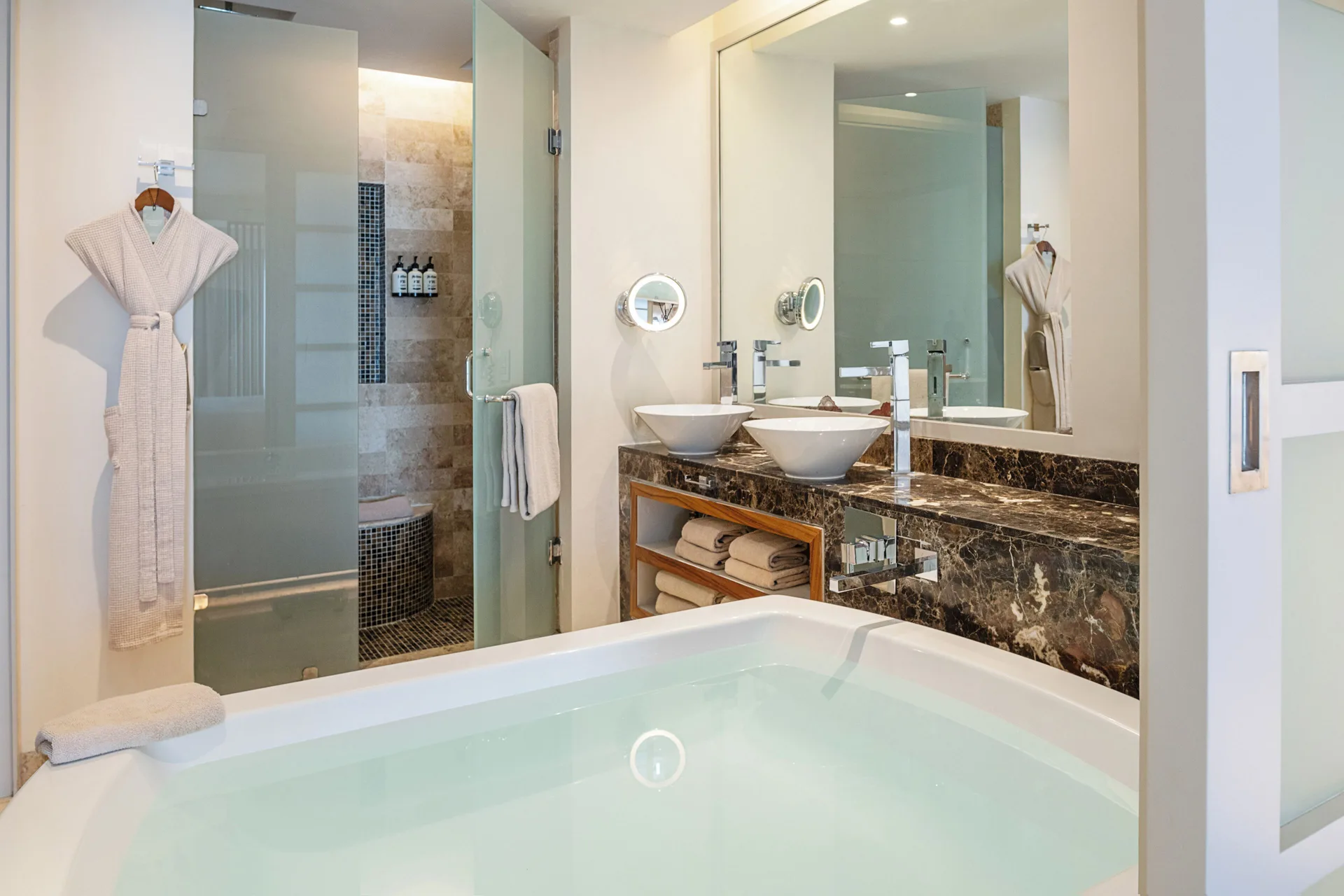 Junior Suite Nature View bathroom with tub and double vanity at Paradisus La Perla Riviera Maya.