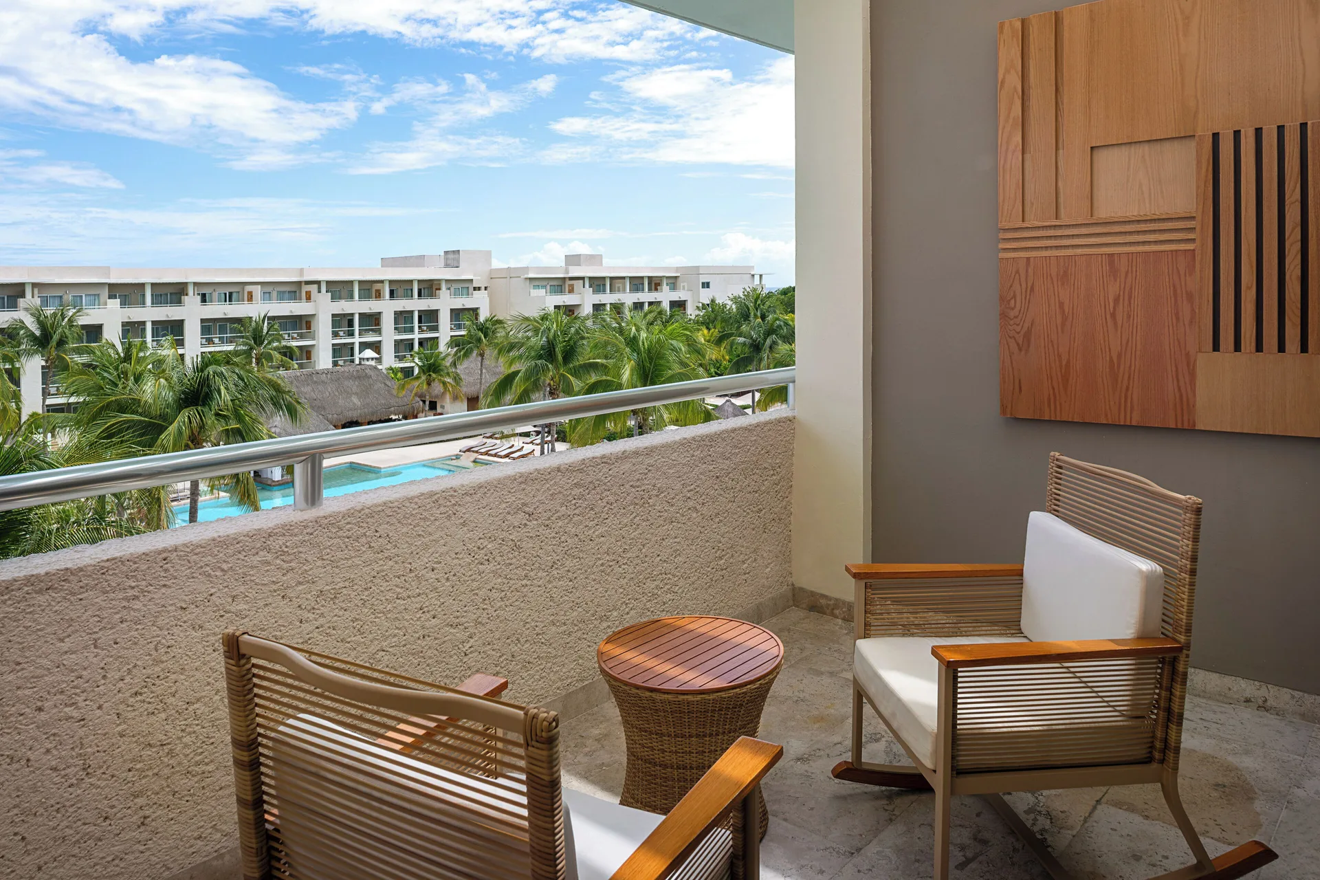Junior Suite Nature View balcony with chairs at Paradisus La Perla Riviera Maya.