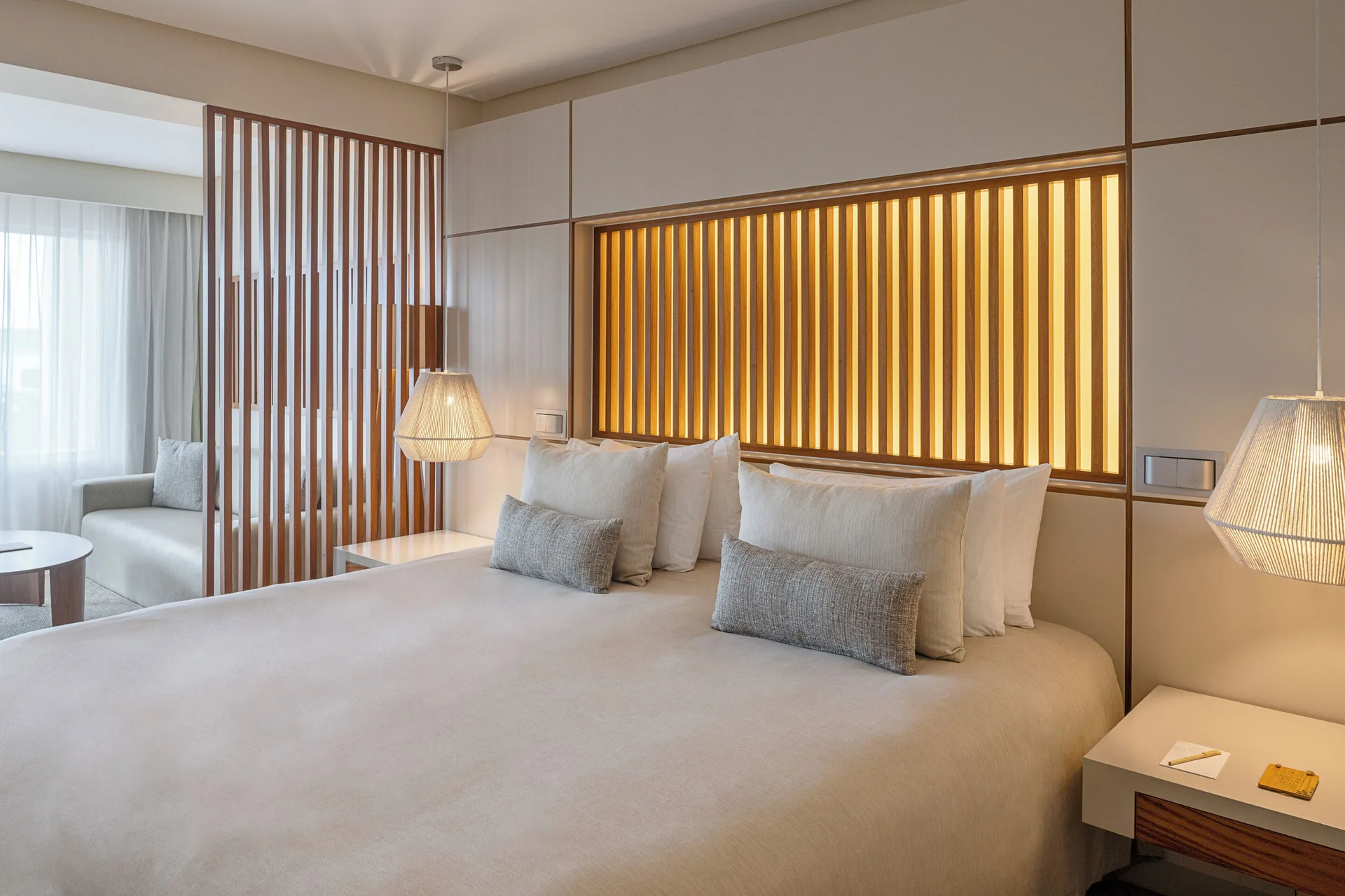 Junior Suite Nature View bedroom with king bed at Paradisus La Perla Riviera Maya.